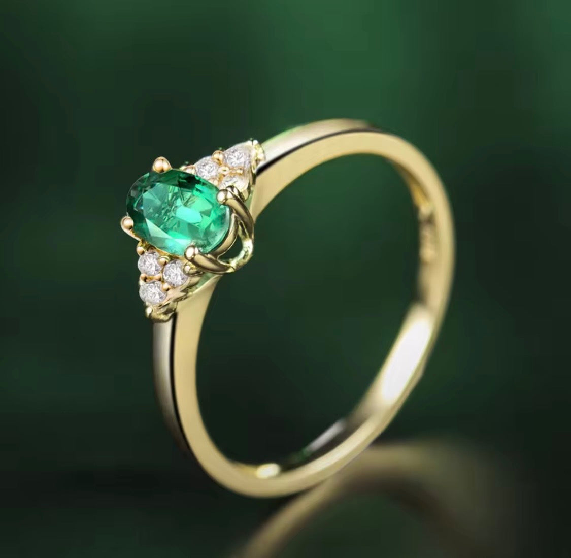18K yellow gold emerald diamond ring with 0.50 carat oval natural emerald and diamond accents