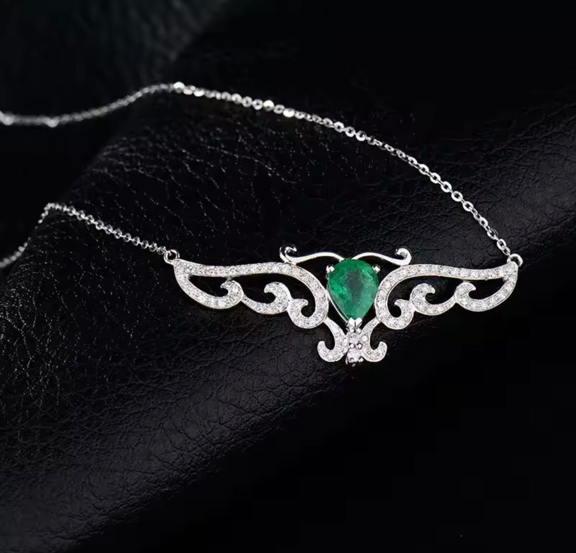 18K gold emerald diamond pendant with 0.66 carat pear cut natural emerald and angel wings design