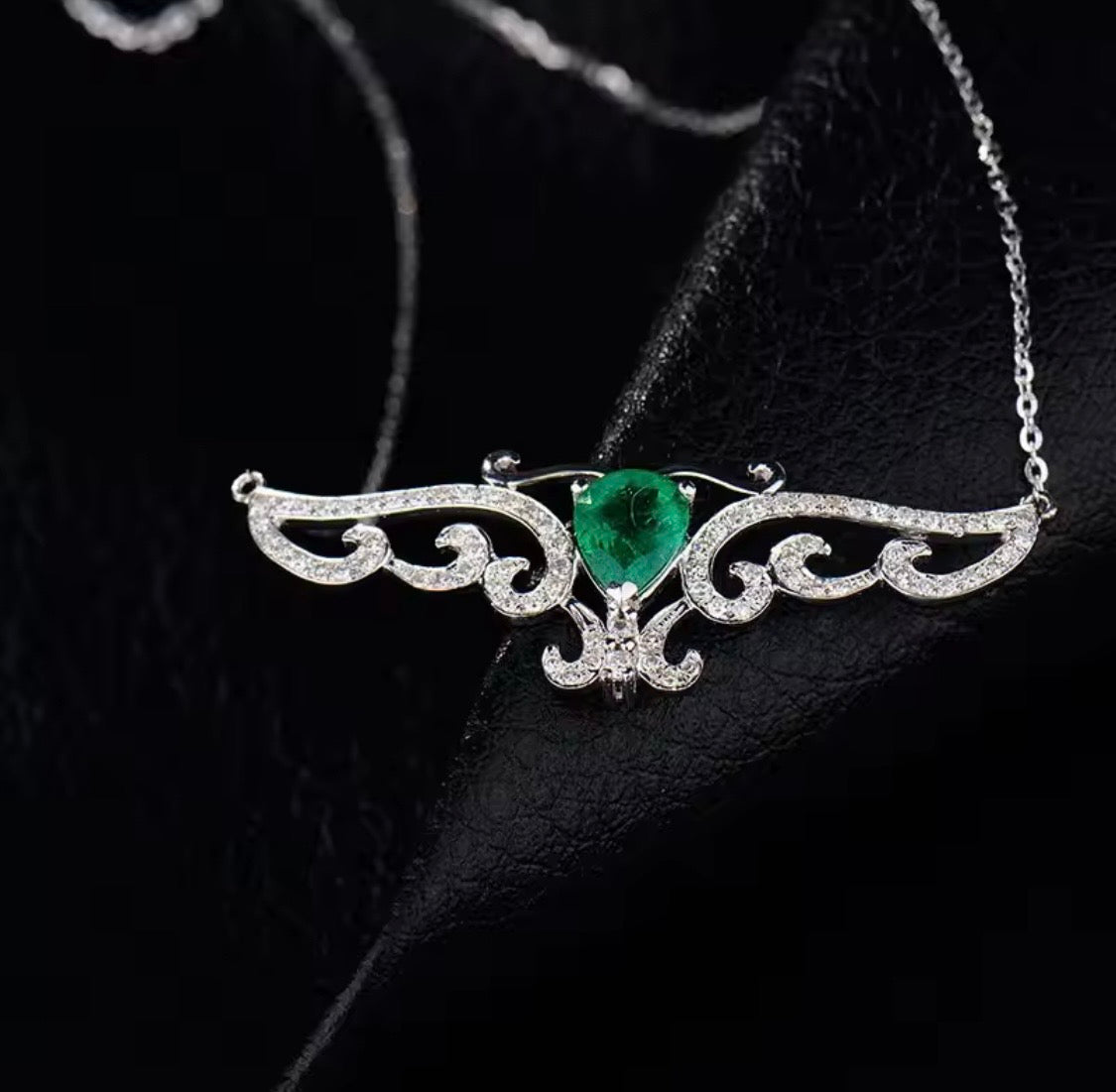 18K gold emerald diamond pendant with 0.66 carat pear cut natural emerald and angel wings design