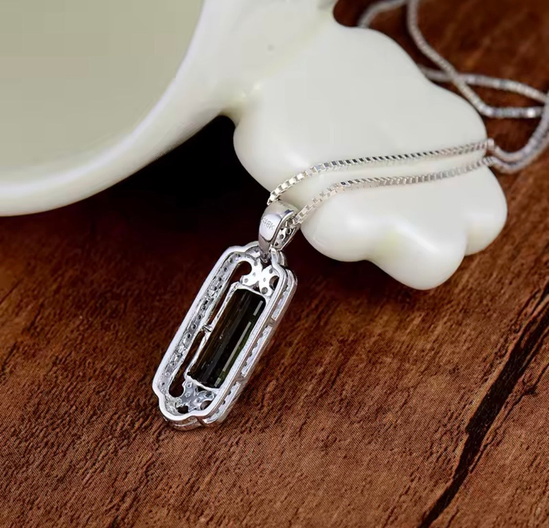 14K gold green tourmaline pendant with 2.05 carat emerald cut gemstone and diamond frame