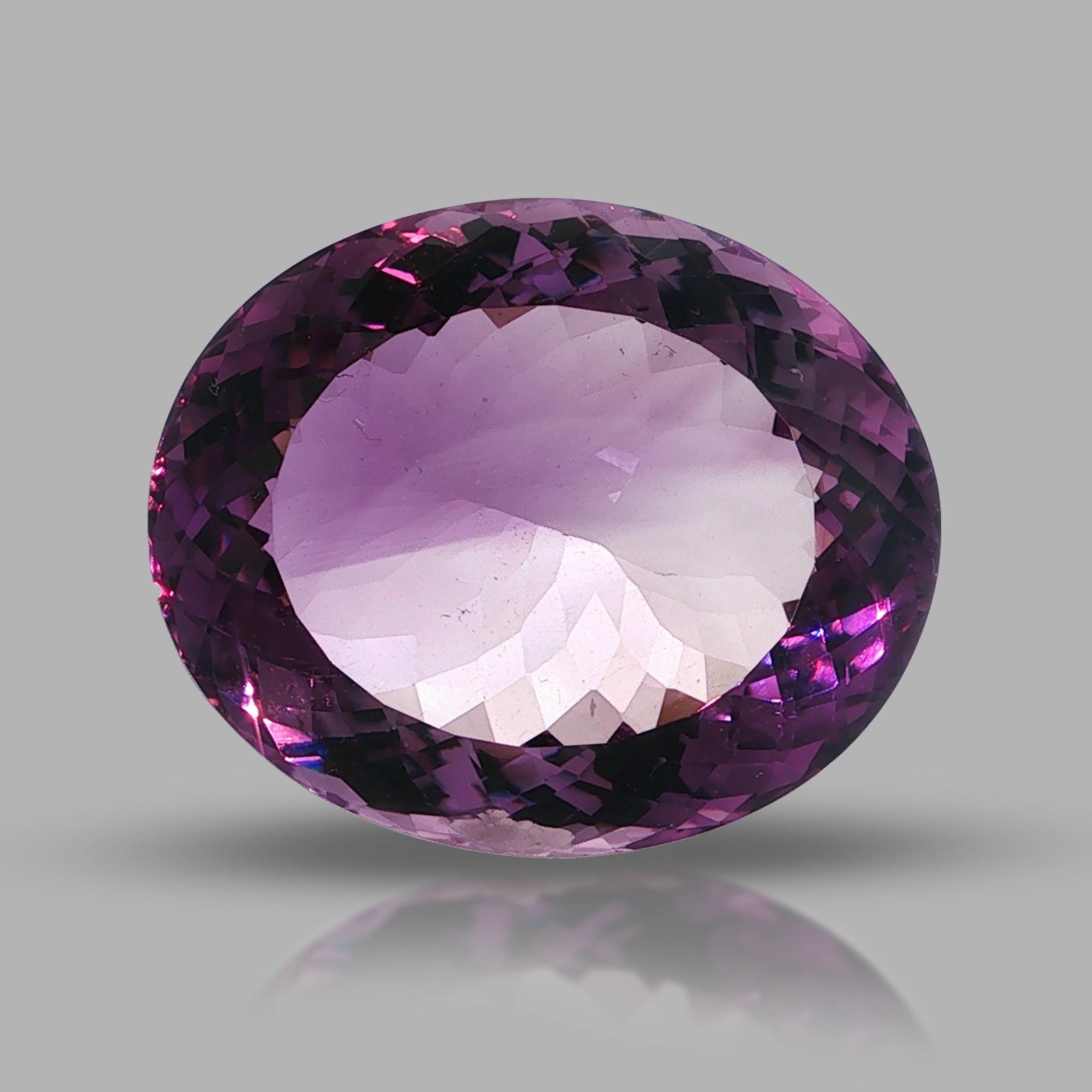 Natural amethyst, 106.80 carats, oval cut, clarity: eye clean, purple color, measuring 35.65 × 29.53 × 17.48 mm