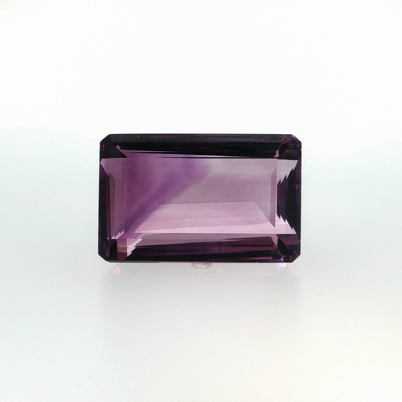 Natural amethyst, 144.05 carats, emerald cut, clarity: eye clean, purple color, measuring 36.80 × 23.60 × 17.48 mm