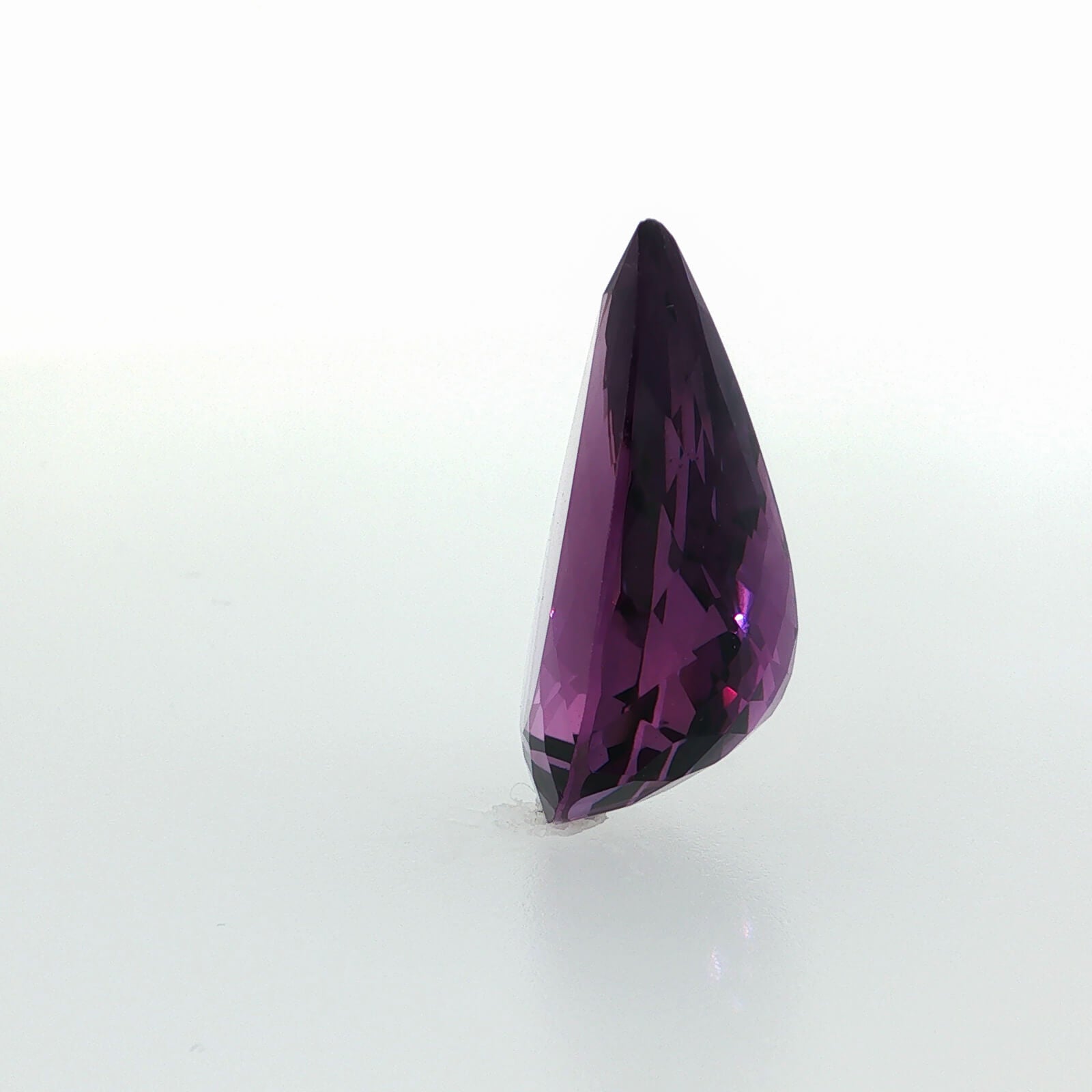 Natural amethyst, 26.49 carats, pear cut, clarity: eye clean, rich purple color, measuring 26.24 × 18.05 × 11.27 mm