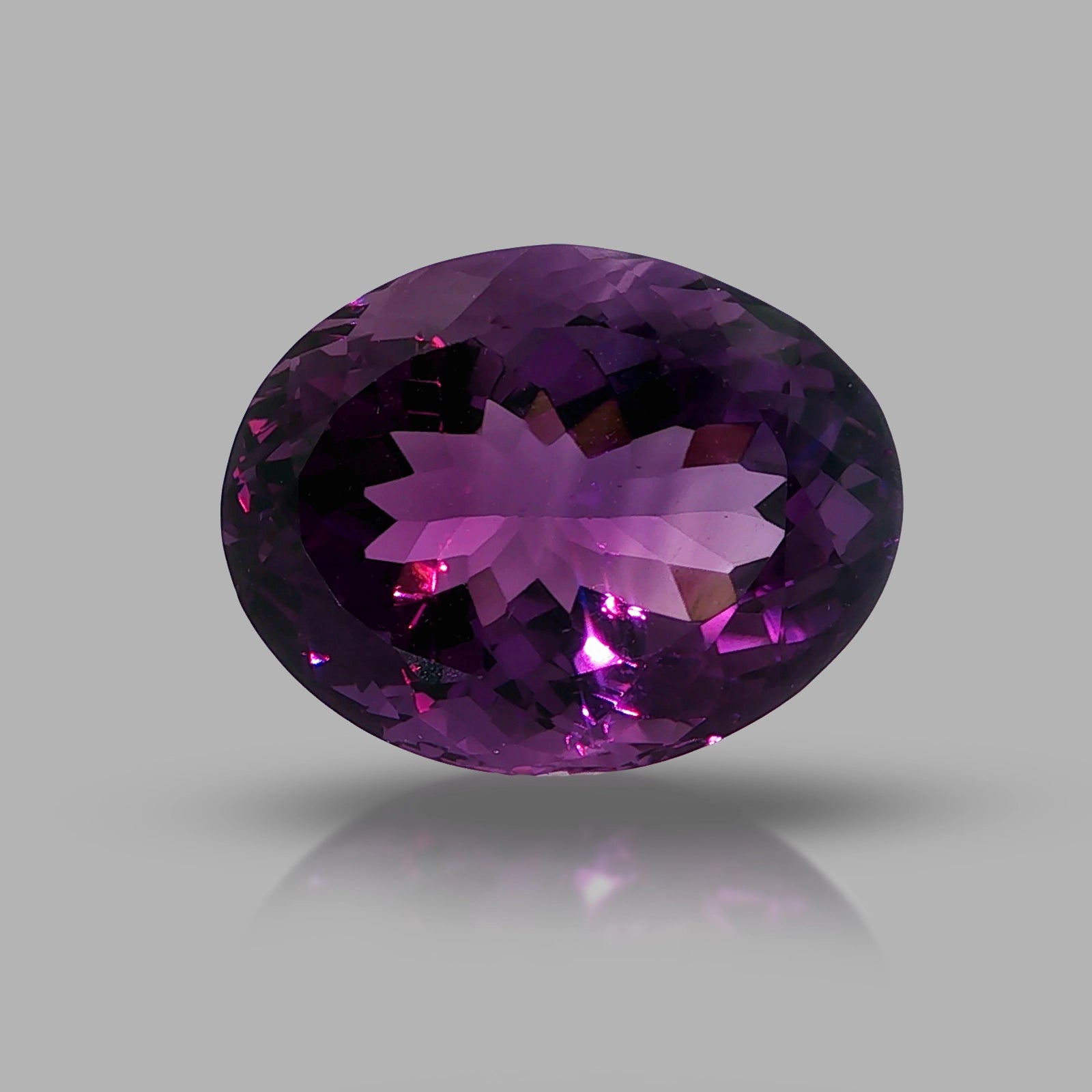 Natural amethyst, 33.56 carats, oval cut, clarity: eye clean, rich purple color, measuring 23.80 × 18.60 × 13.70 mm