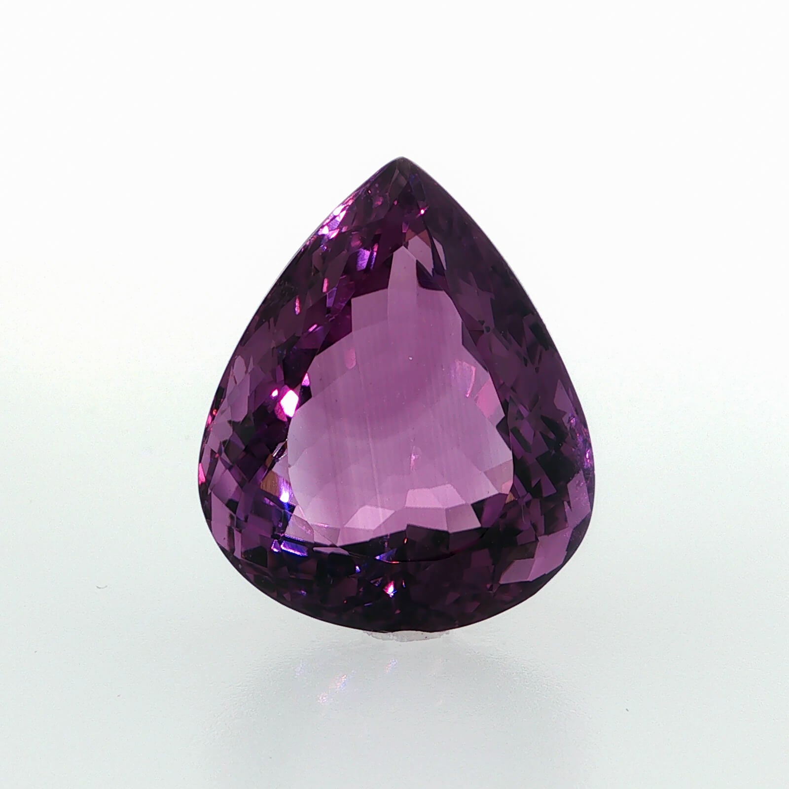 Natural amethyst, 40.07 carats, pear cut, clarity: eye clean, vibrant purple color, measuring 25.39 × 21.24 × 13.74 mm