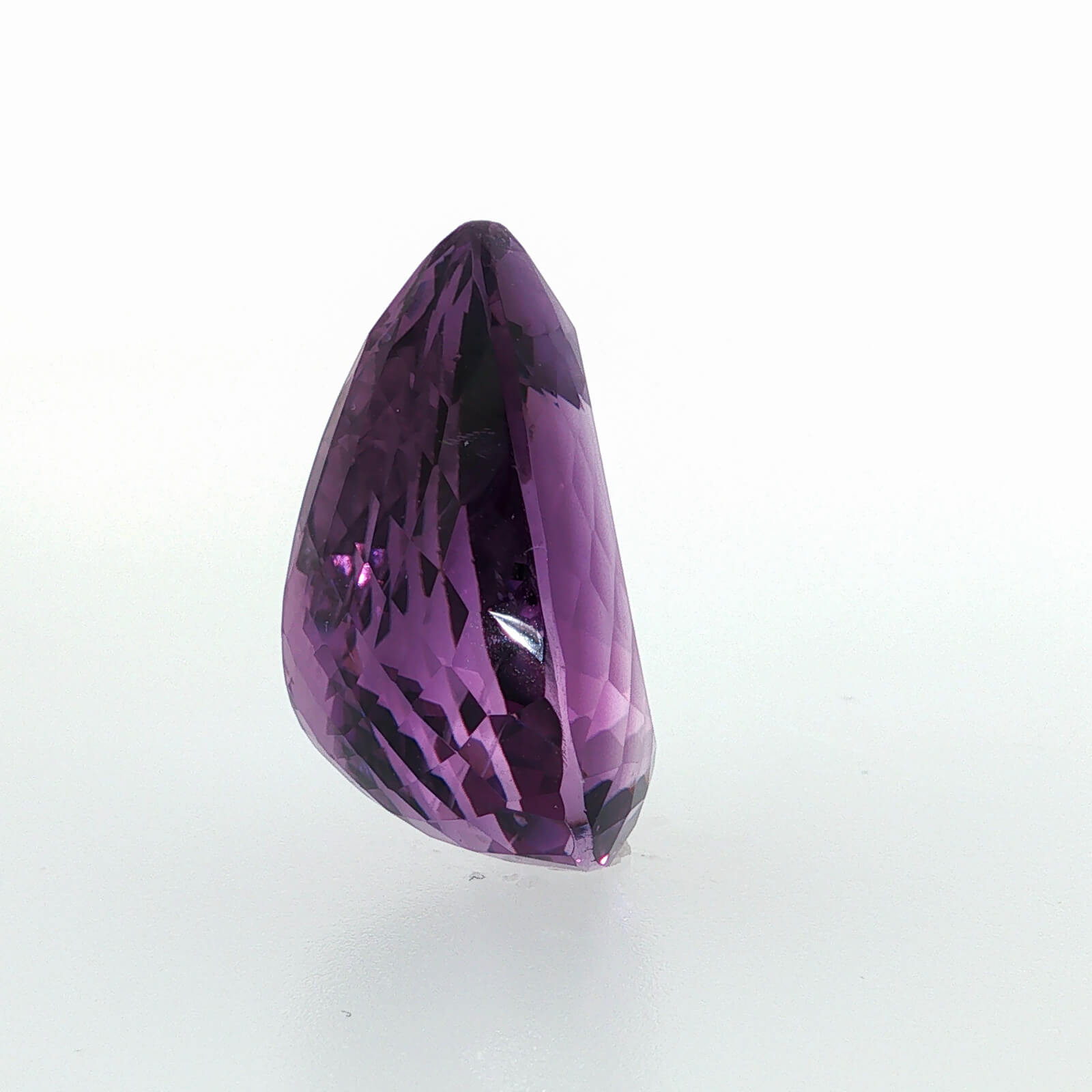 Natural amethyst, 40.07 carats, pear cut, clarity: eye clean, vibrant purple color, measuring 25.39 × 21.24 × 13.74 mm