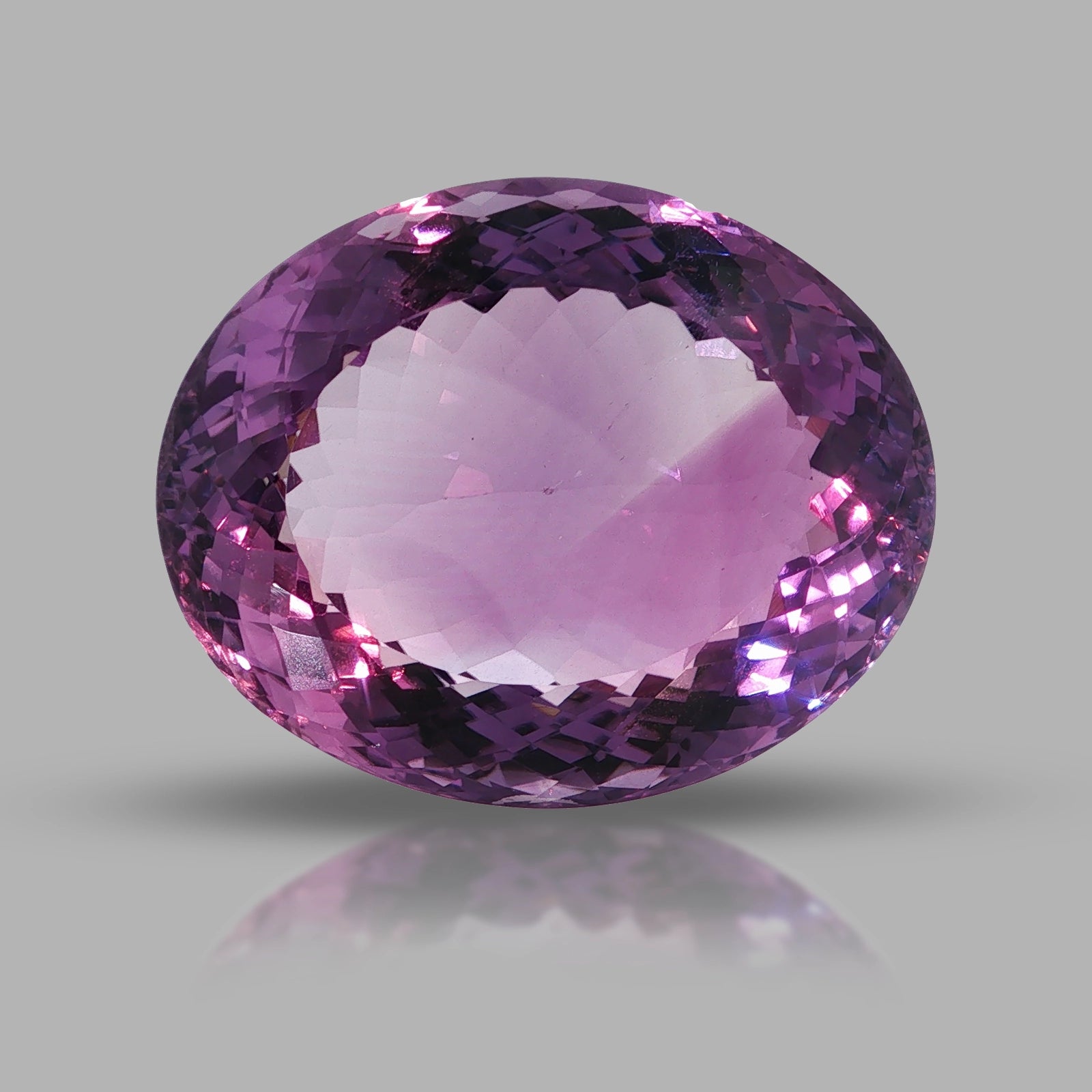 Natural amethyst, 97.50 carats, oval cut, clarity: eye clean, purple color, measuring 33.99 × 27.62 × 16.91 mm