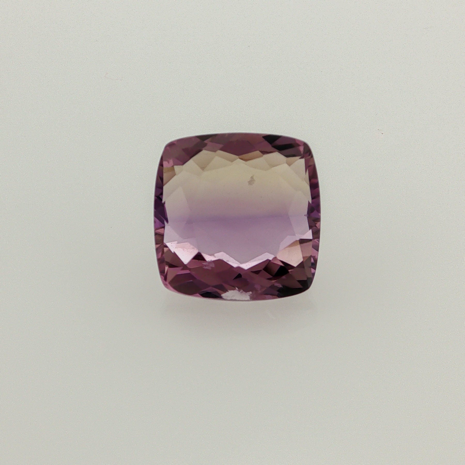 Natural ametrine, bicolor - vivid purple / vivid yellow, cushion cut, 10.36 ct, loose gemstone.
