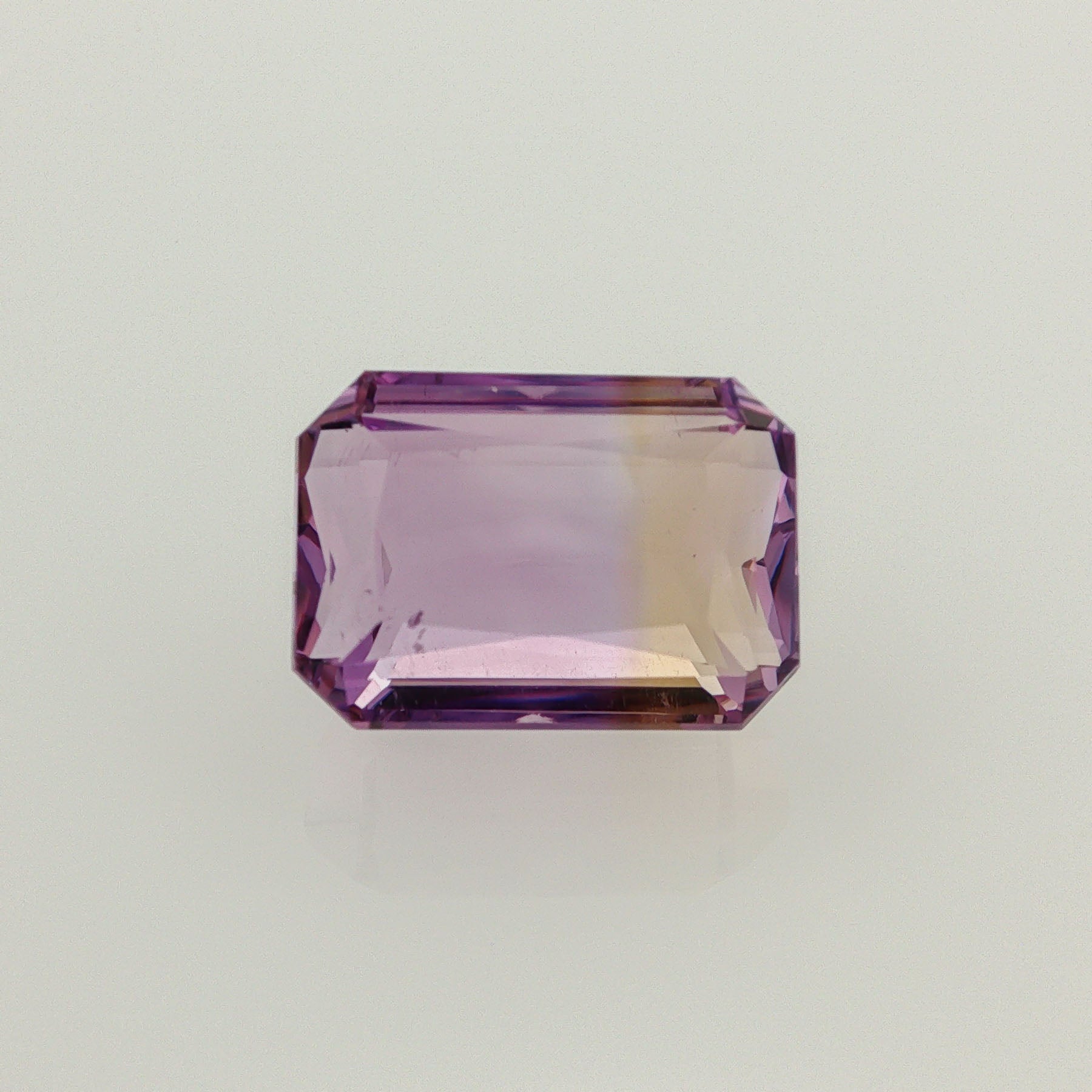 Natural ametrine, bicolor - purple / yellow, emerald cut, 16.11 ct, loose gemstone.