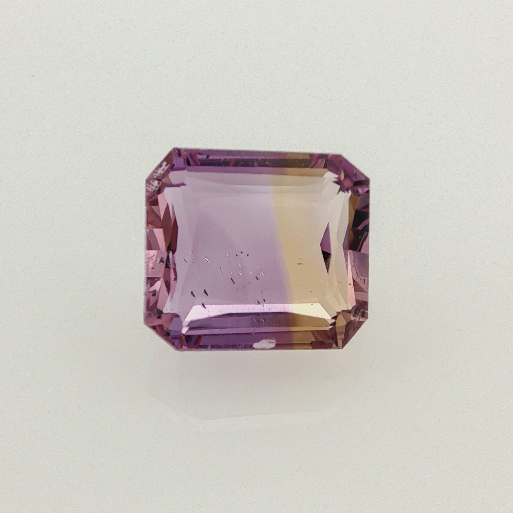 Natural ametrine, bicolor - vivid purple / vivid yellow, octagon cut, 17.13 ct, loose gemstone.