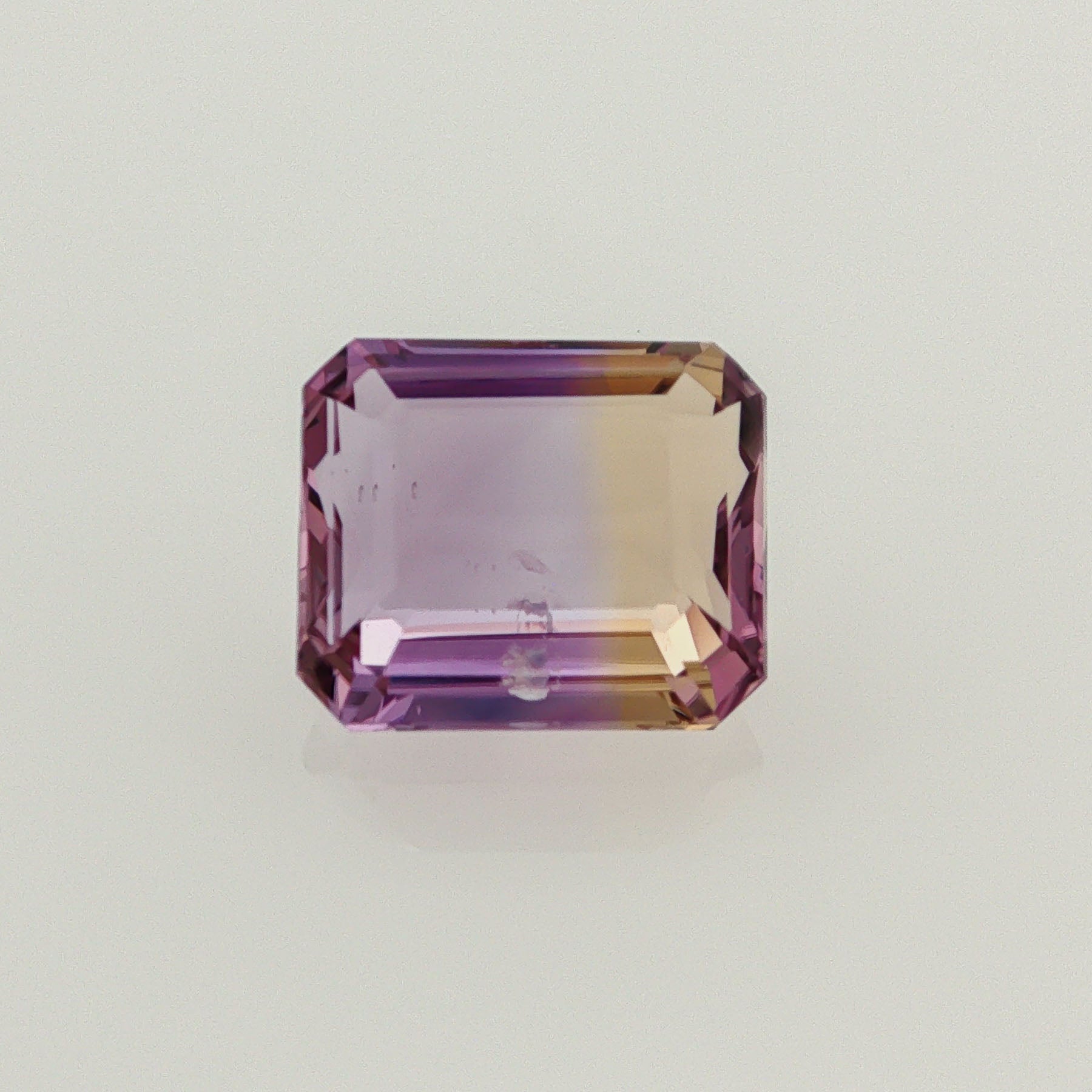 Natural ametrine, bicolor - vivid purple / vivid yellow, emerald cut, 7.18 ct, loose gemstone.