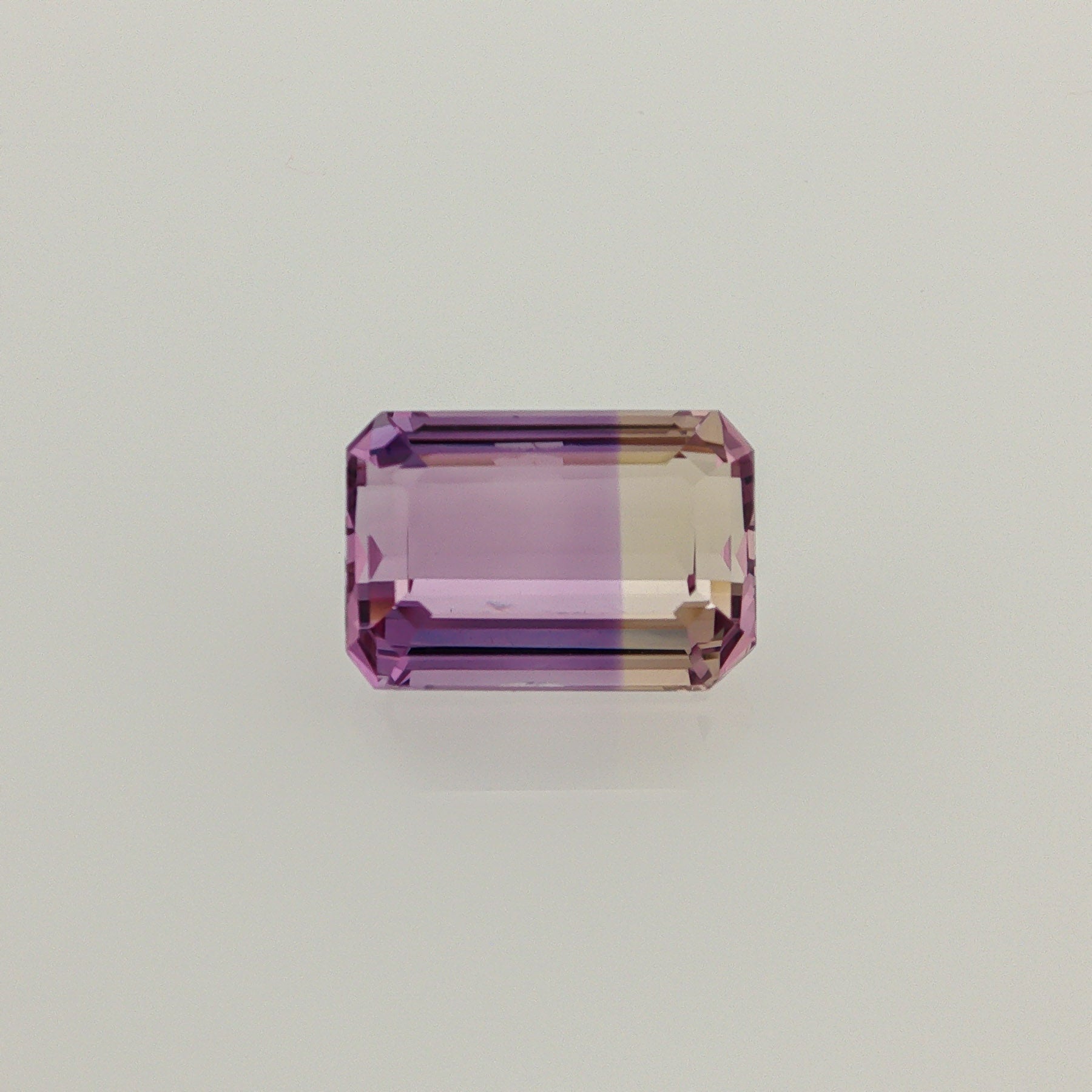 Natural ametrine, bicolor - purple / yellow, emerald cut, 7.67 ct, loose gemstone.