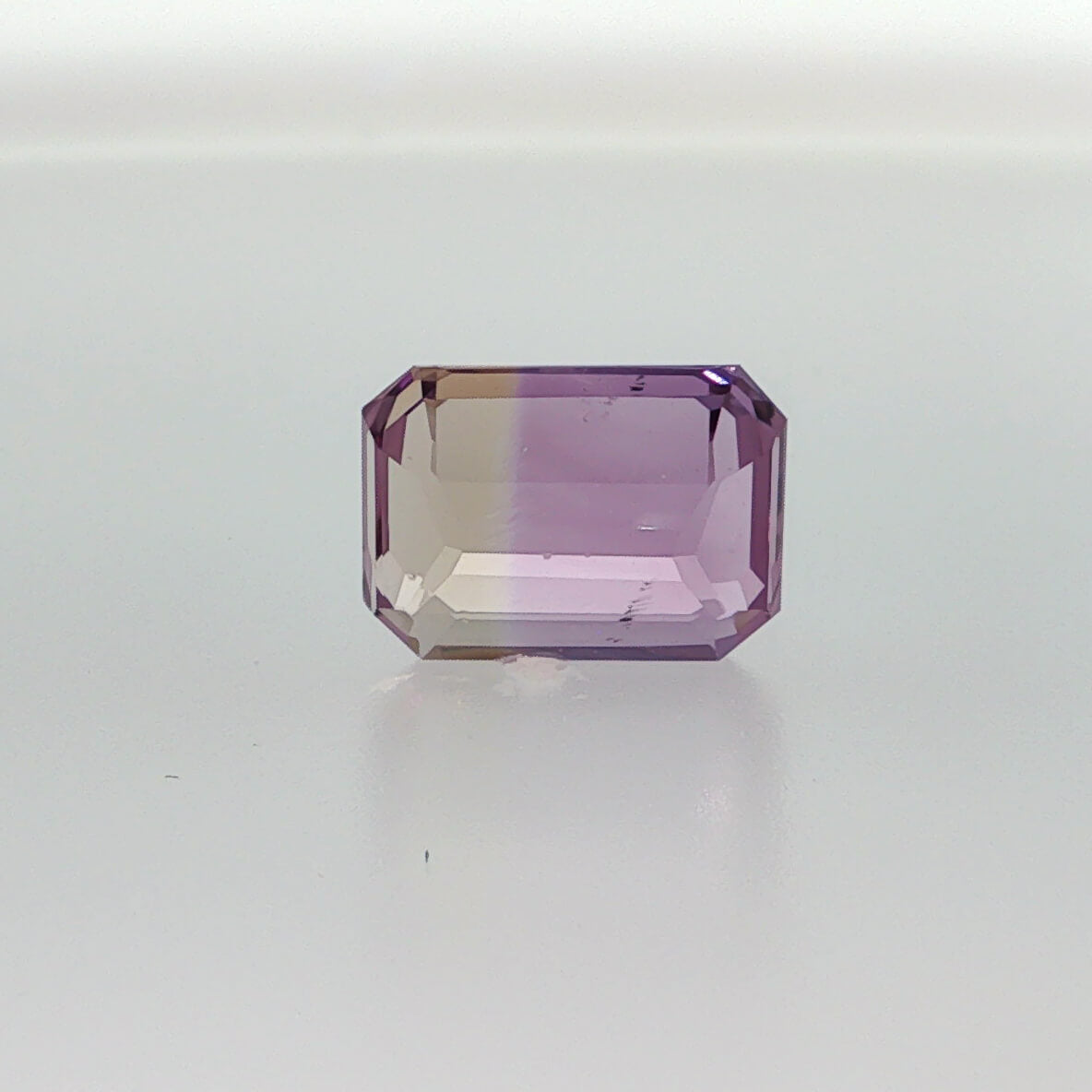 Natural untreated ametrine, 8.24 carats, emerald cut, clarity: slightly included, purple and golden yellow bi-color quartz, measuring 14.26 × 10.59 × 6.73 mm
