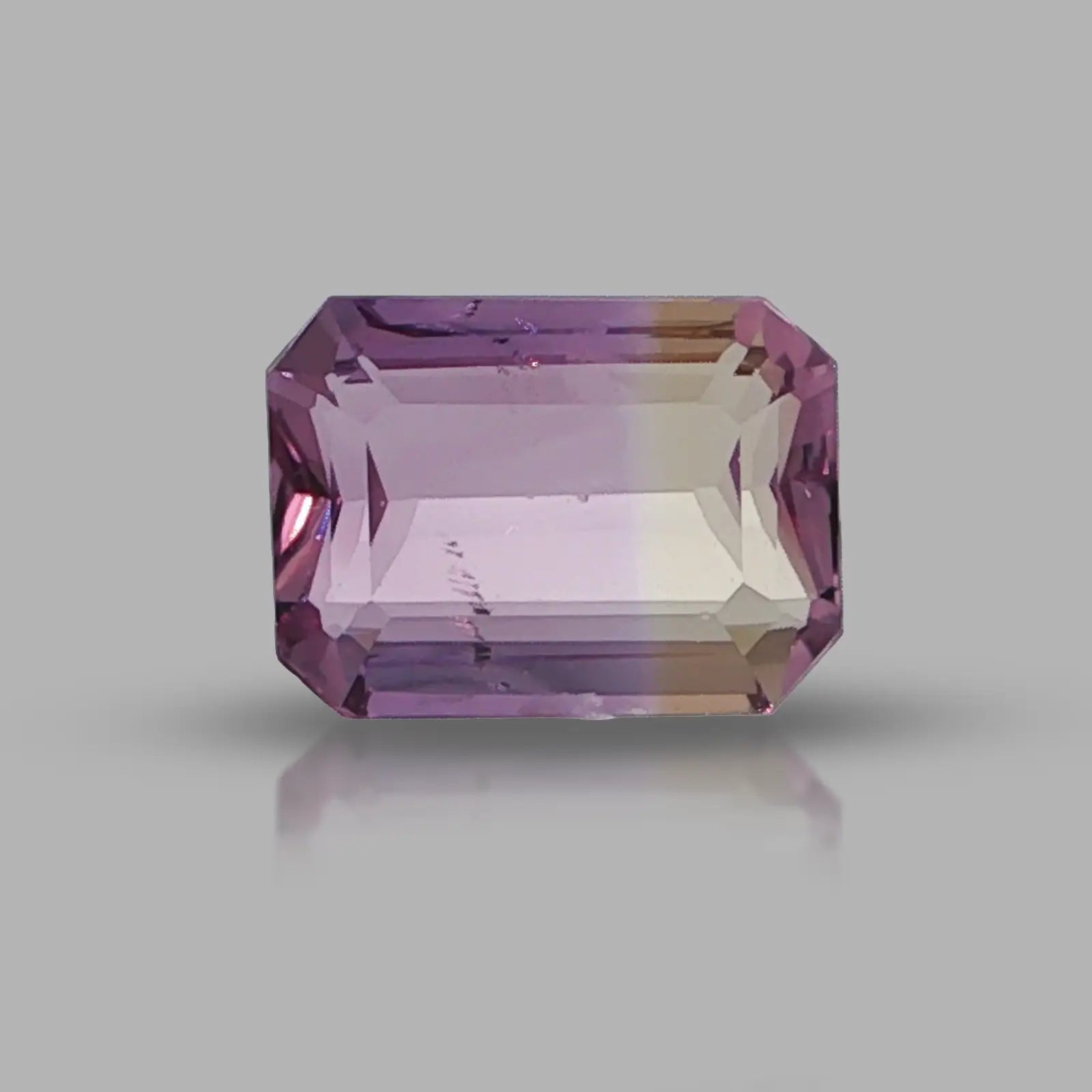 Natural untreated ametrine, 8.24 carats, emerald cut, clarity: slightly included, purple and golden yellow bi-color quartz, measuring 14.26 × 10.59 × 6.73 mm