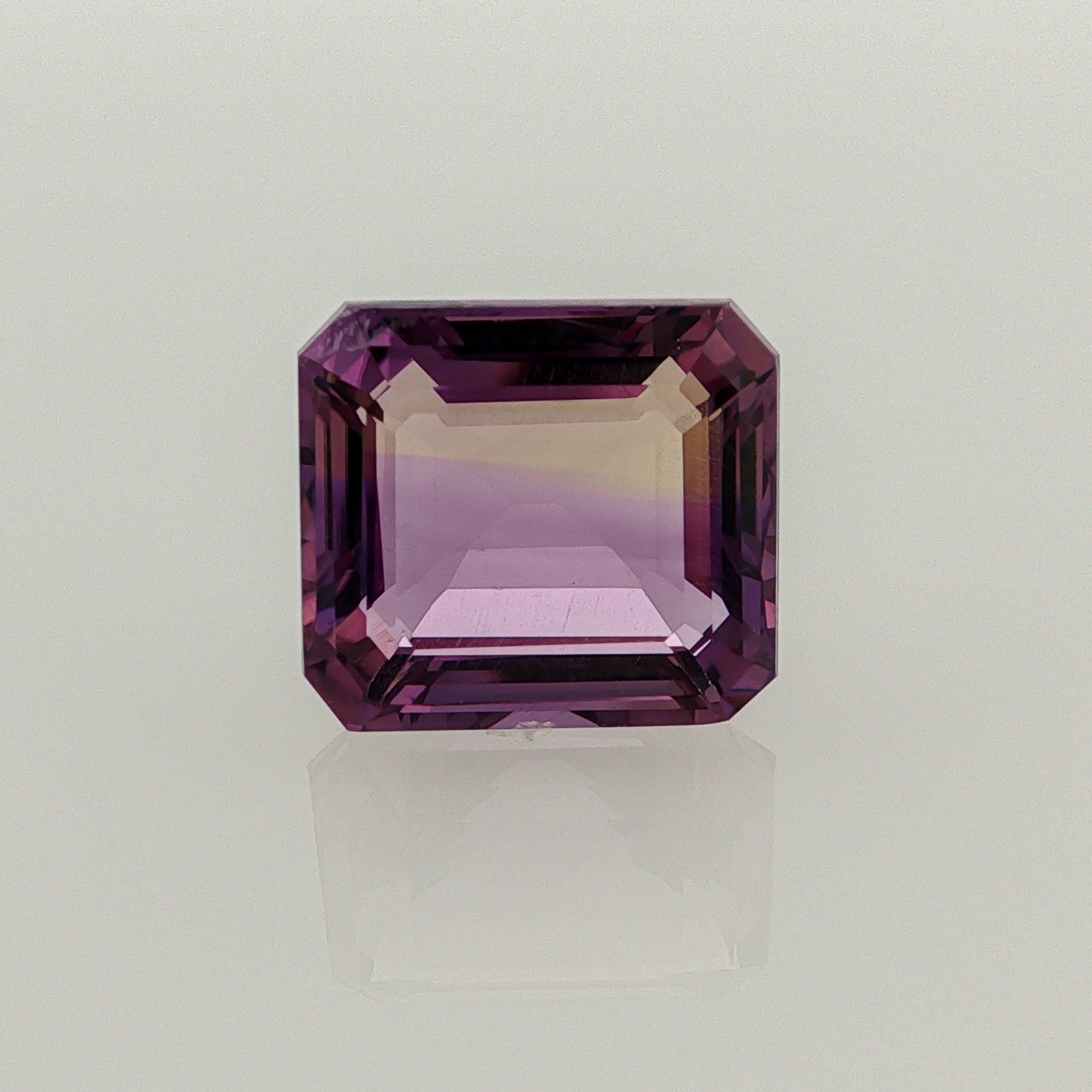 Natural ametrine, bicolor - vivid purple / very light yellow, emerald cut, 9.07 ct, loose gemstone.