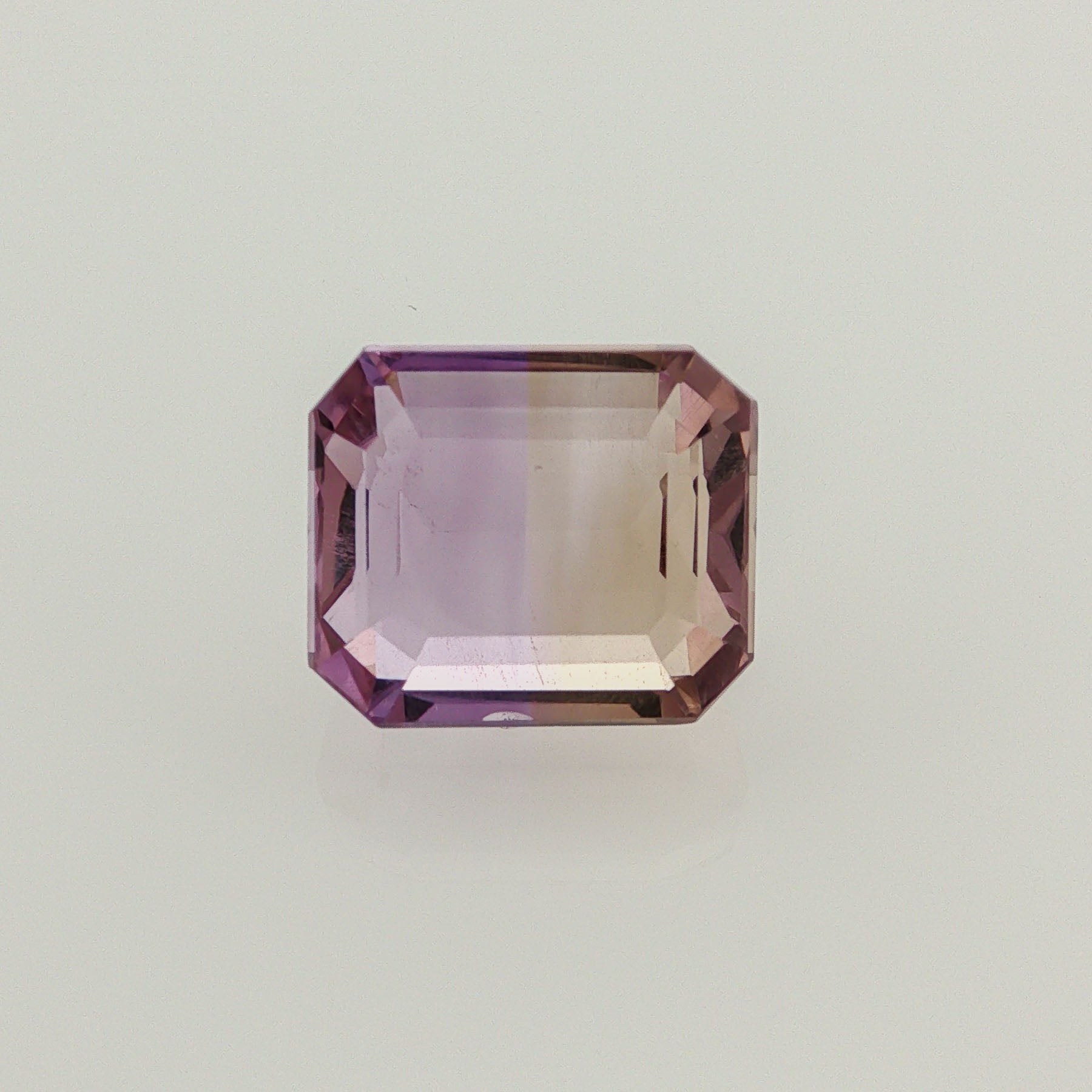 Natural ametrine, bicolor - purple / yellow, emerald cut, 9.48 ct, loose gemstone.