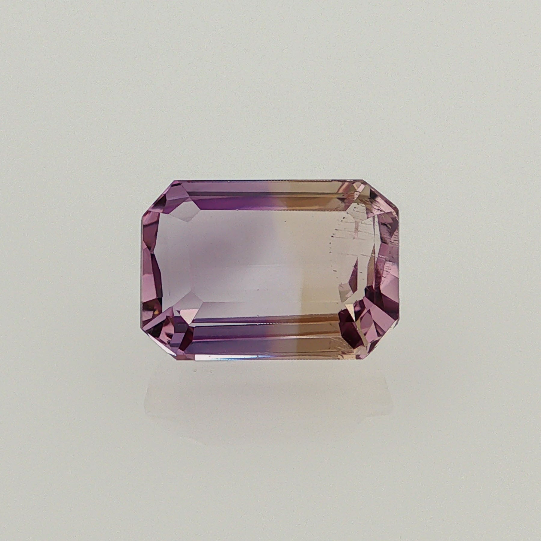 Natural ametrine, bicolor - purple / yellow, emerald cut, 9.53 ct, loose gemstone.