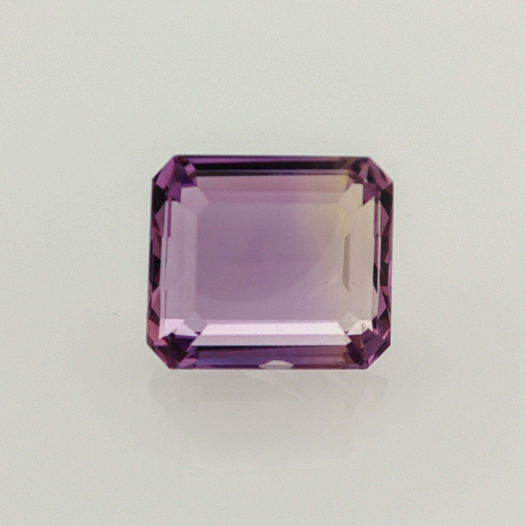 Natural ametrine, bicolor - vivid purple / yellow, emerald cut, 9.62 ct, loose gemstone.