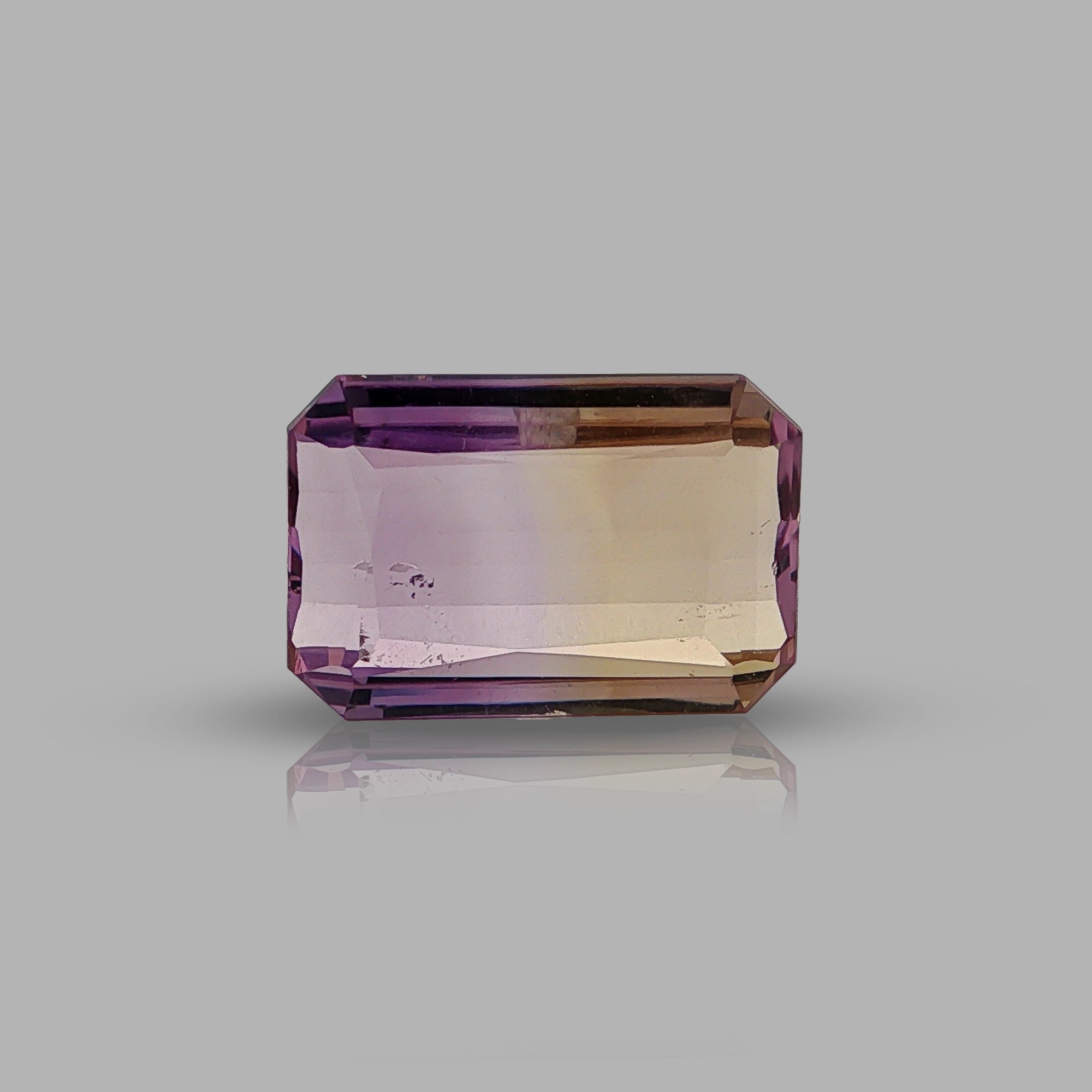 Natural ametrine, bicolor - purple / yellow, emerald cut, 9.76 ct, loose gemstone.