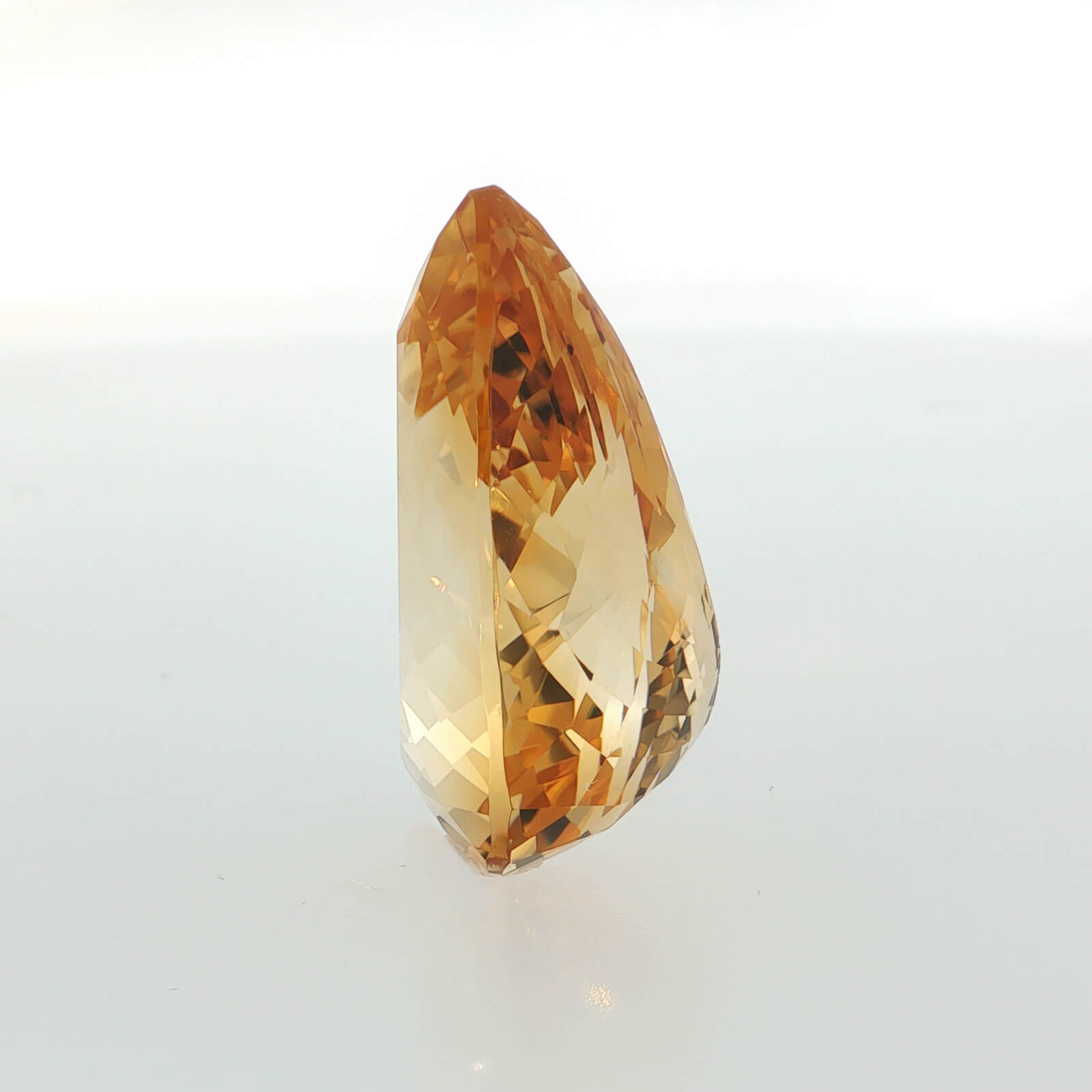 Natural citrine, 42.68 carats, pear cut, golden-yellow color, measuring 28.28 × 21.12 × 13.28 mm
