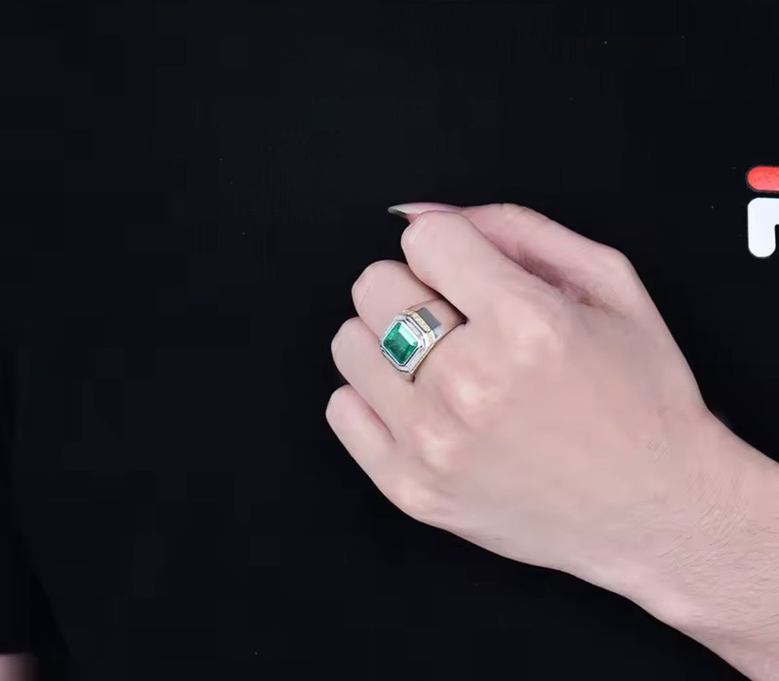 Natural emerald and diamond unisex ring in 18K white gold worn on hand