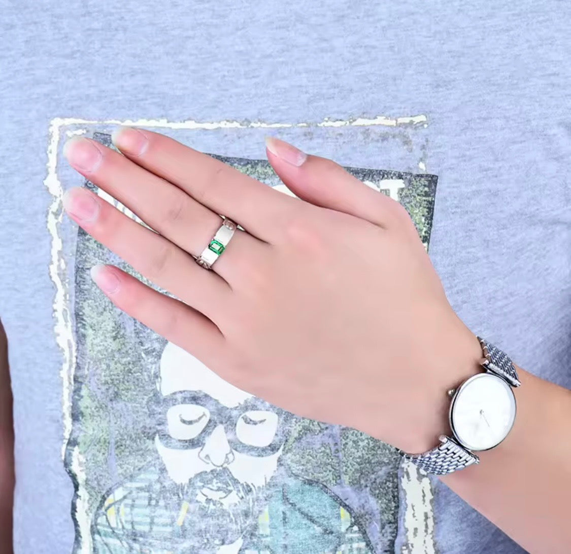 Natural emerald unisex ring in 14K white gold worn on hand