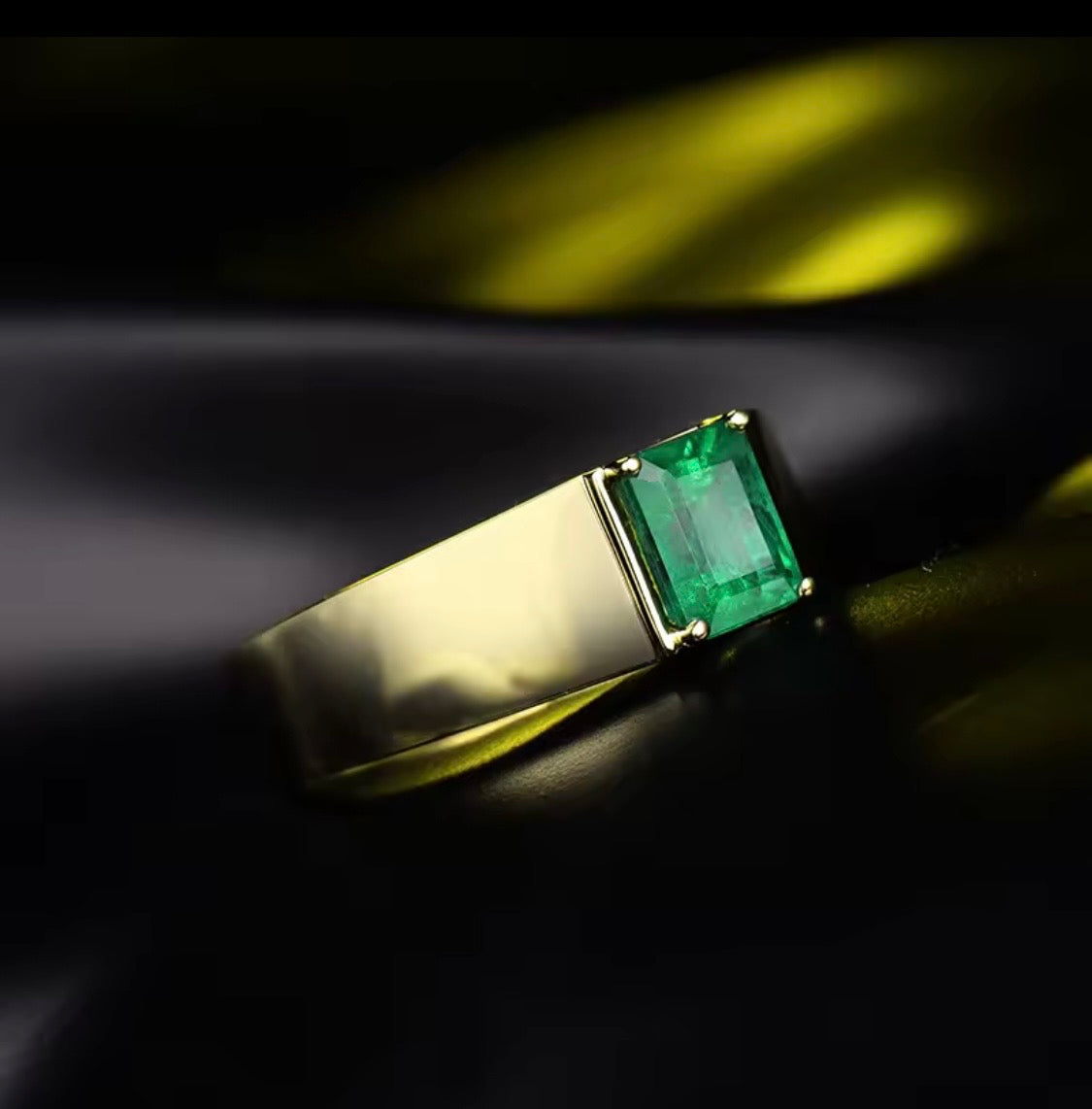 Natural emerald unisex statement ring in 14K yellow gold lifestyle view