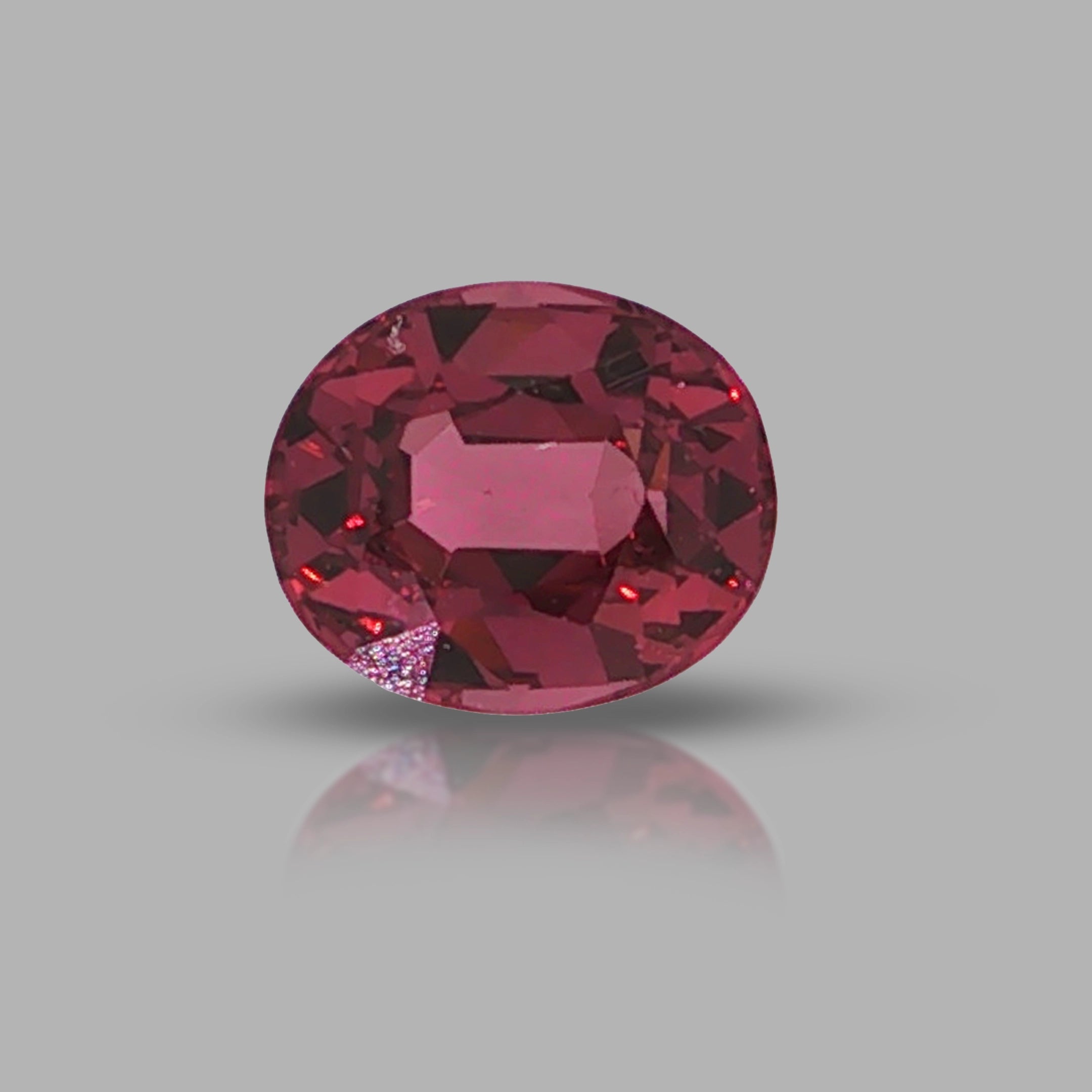 Natural pyrope-almandine garnet, 1.05 carats, oval cut, slightly orangy red color, transparent, ČGL certified gemstone