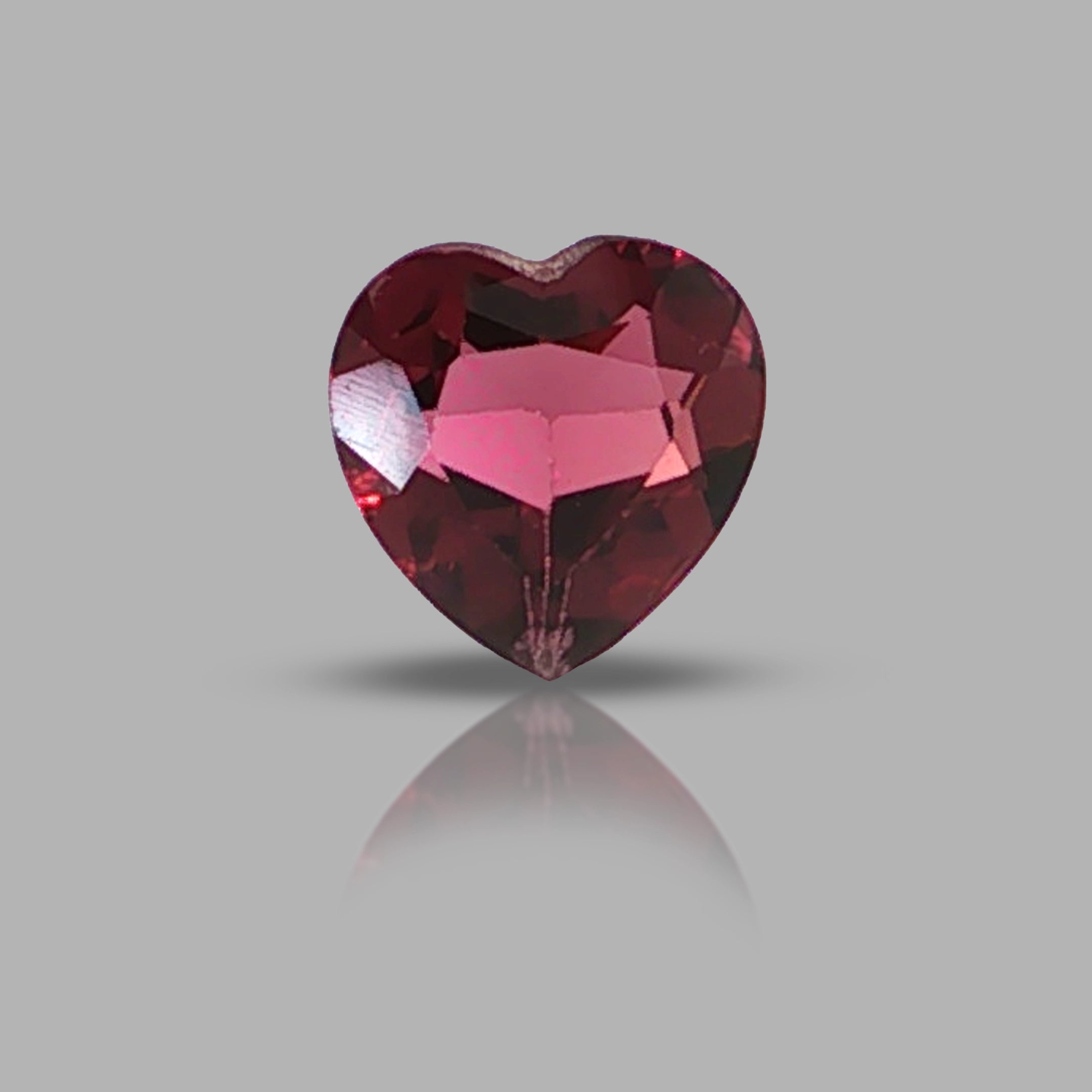 Natural rhodolite garnet, 1.36 carats, heart cut, slightly purplish red color, transparent, ČGL certified gemstone