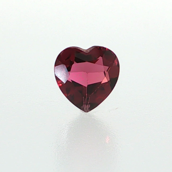 Natural rhodolite garnet, 1.36 carats, heart cut, slightly purplish red color, transparent, ČGL certified gemstone