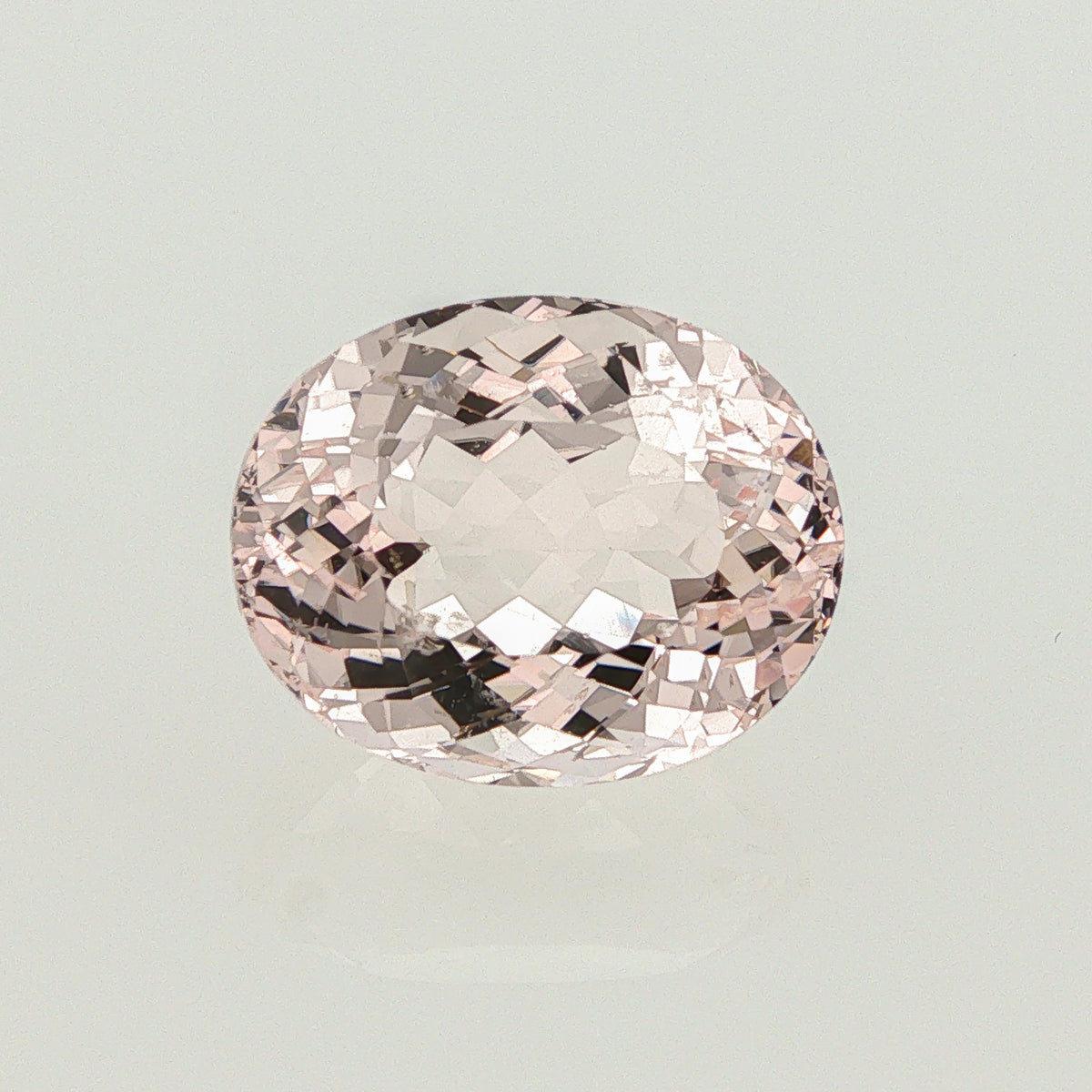 Natural unheated morganite, light orangy pink, oval cut, 12.27 ct, loose gemstone, view 4.