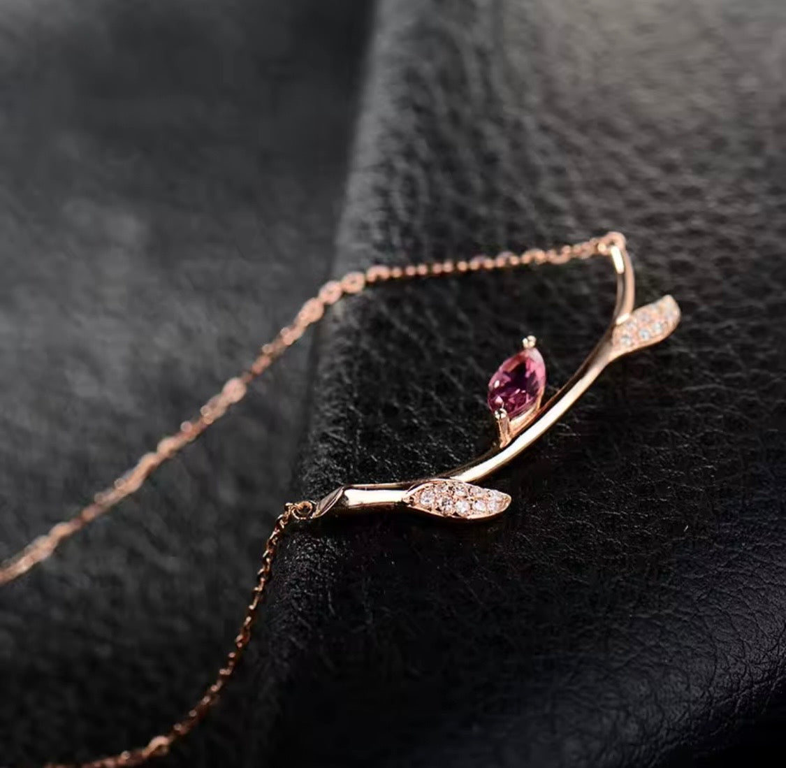 18K rose gold necklace with natural pink tourmaline and diamond leaf details
