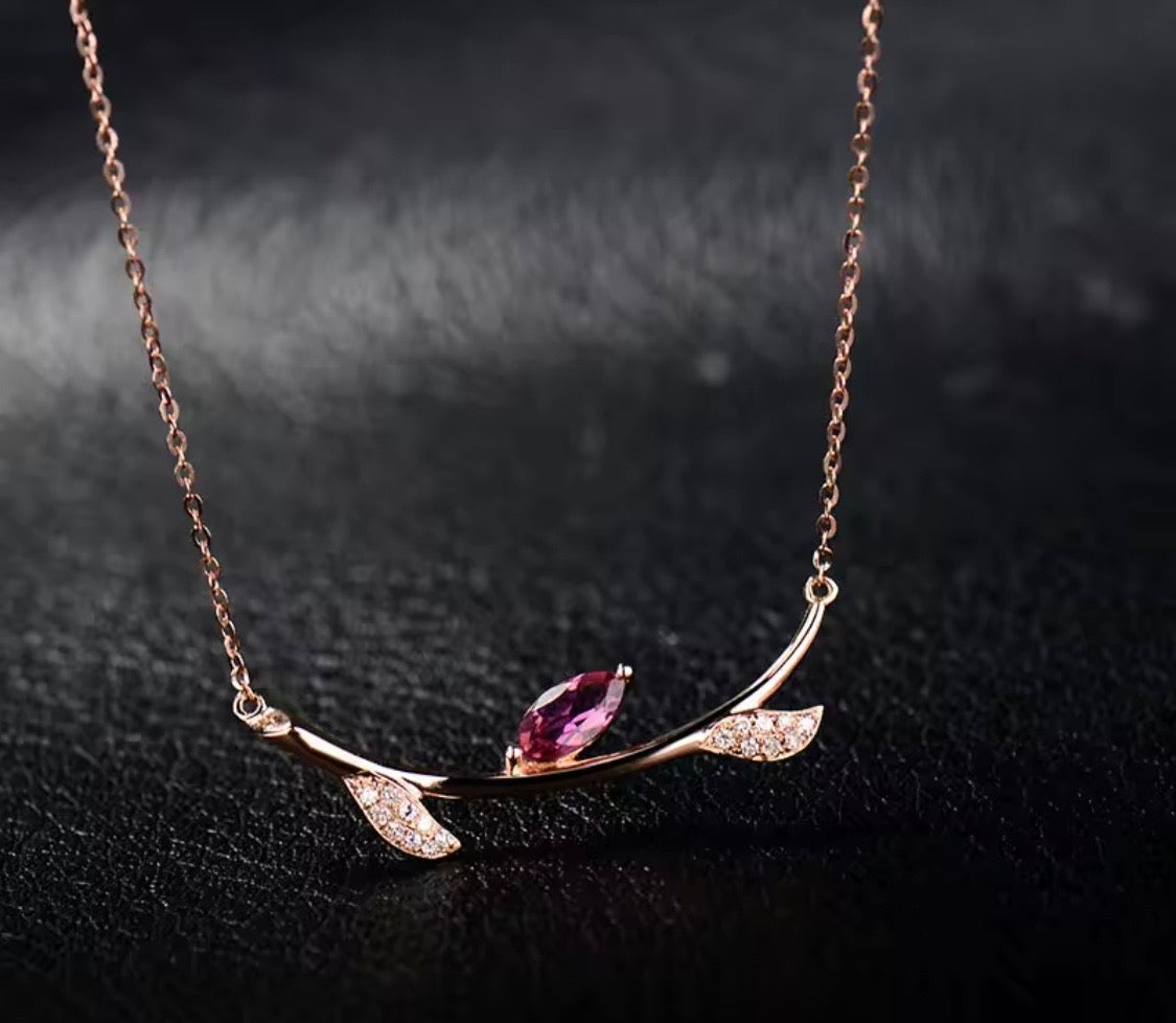 Natural pink tourmaline and diamond necklace in 18K rose gold lifestyle view