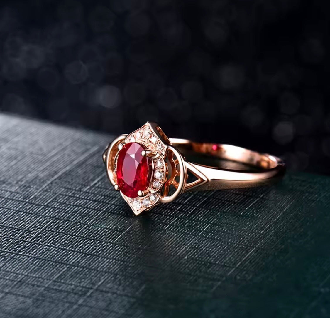 Natural oval ruby and diamond ring in 14K rose gold angle view