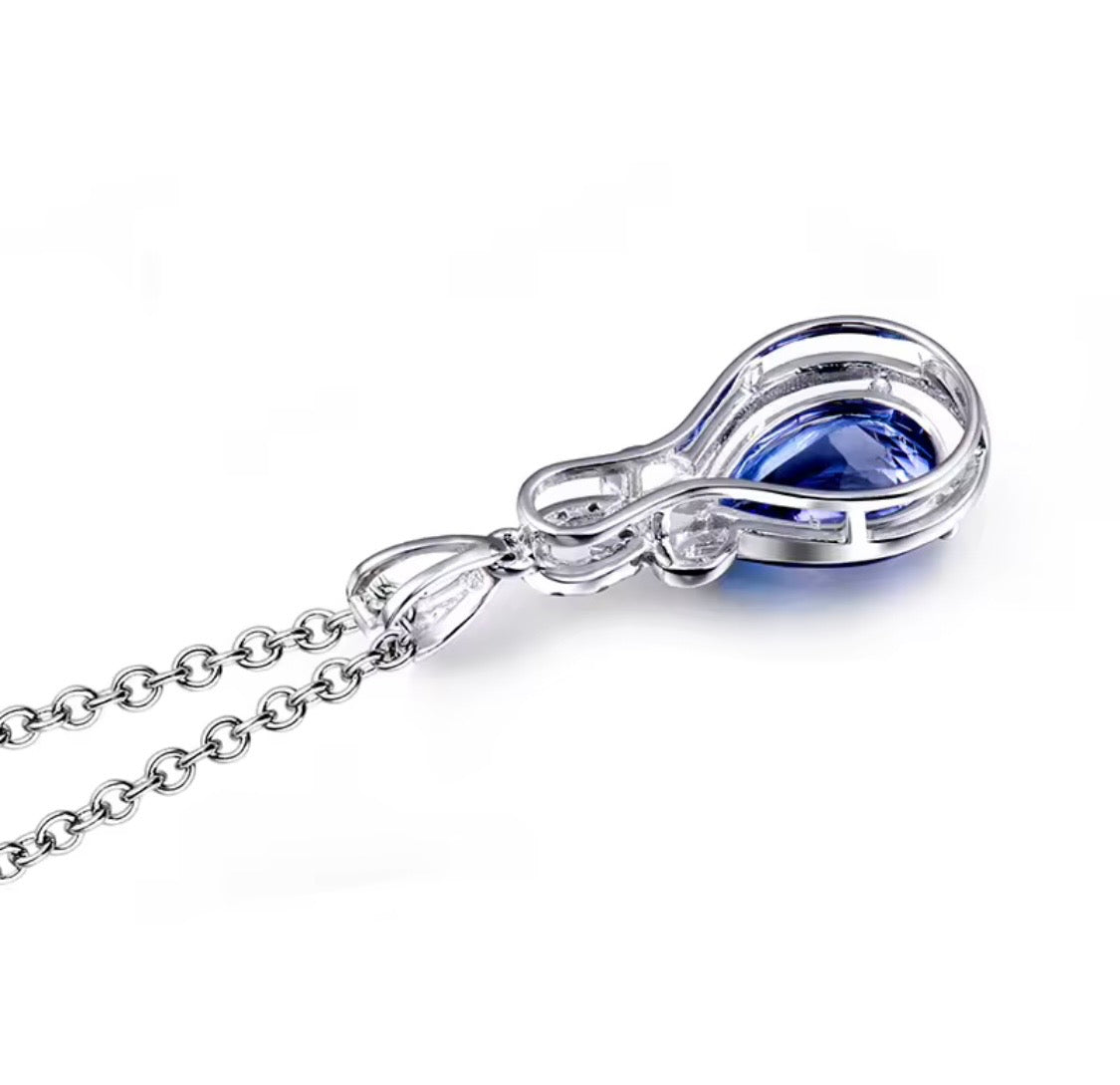 Natural tanzanite diamond pendant in 14K white gold side and setting view