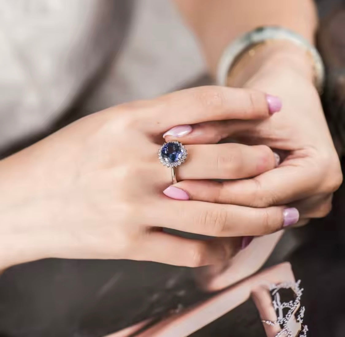 1.60 ct natural tanzanite and diamond ring in 18K white gold worn on hand