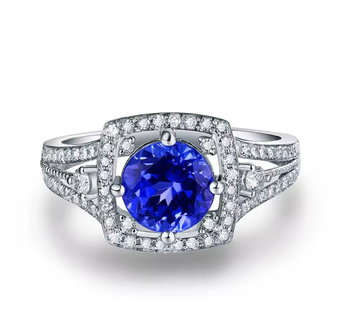 Natural round tanzanite and diamond unisex ring in 14K white gold front view