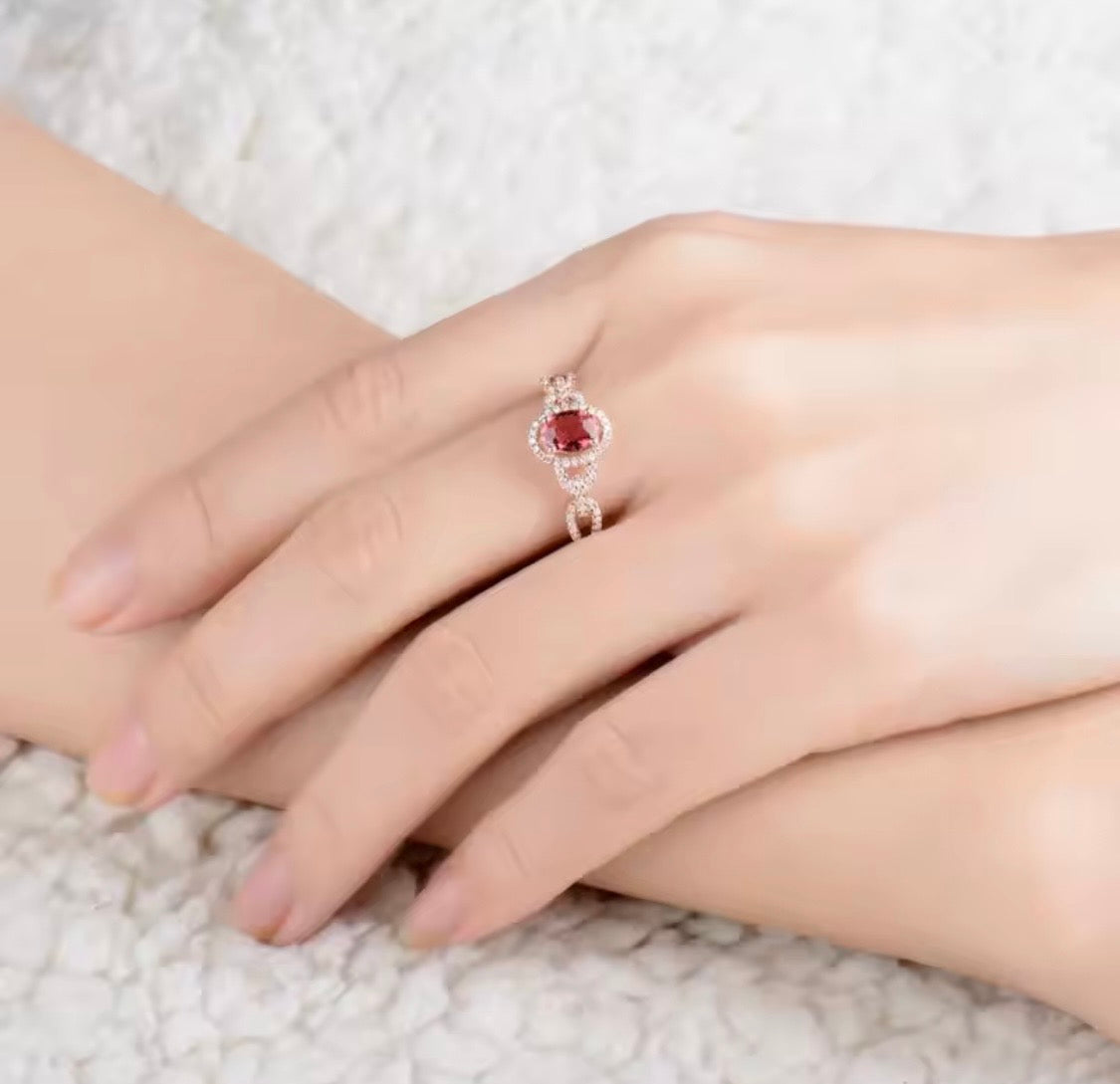 14K rose gold pink tourmaline engagement ring with oval gemstone and diamond halo