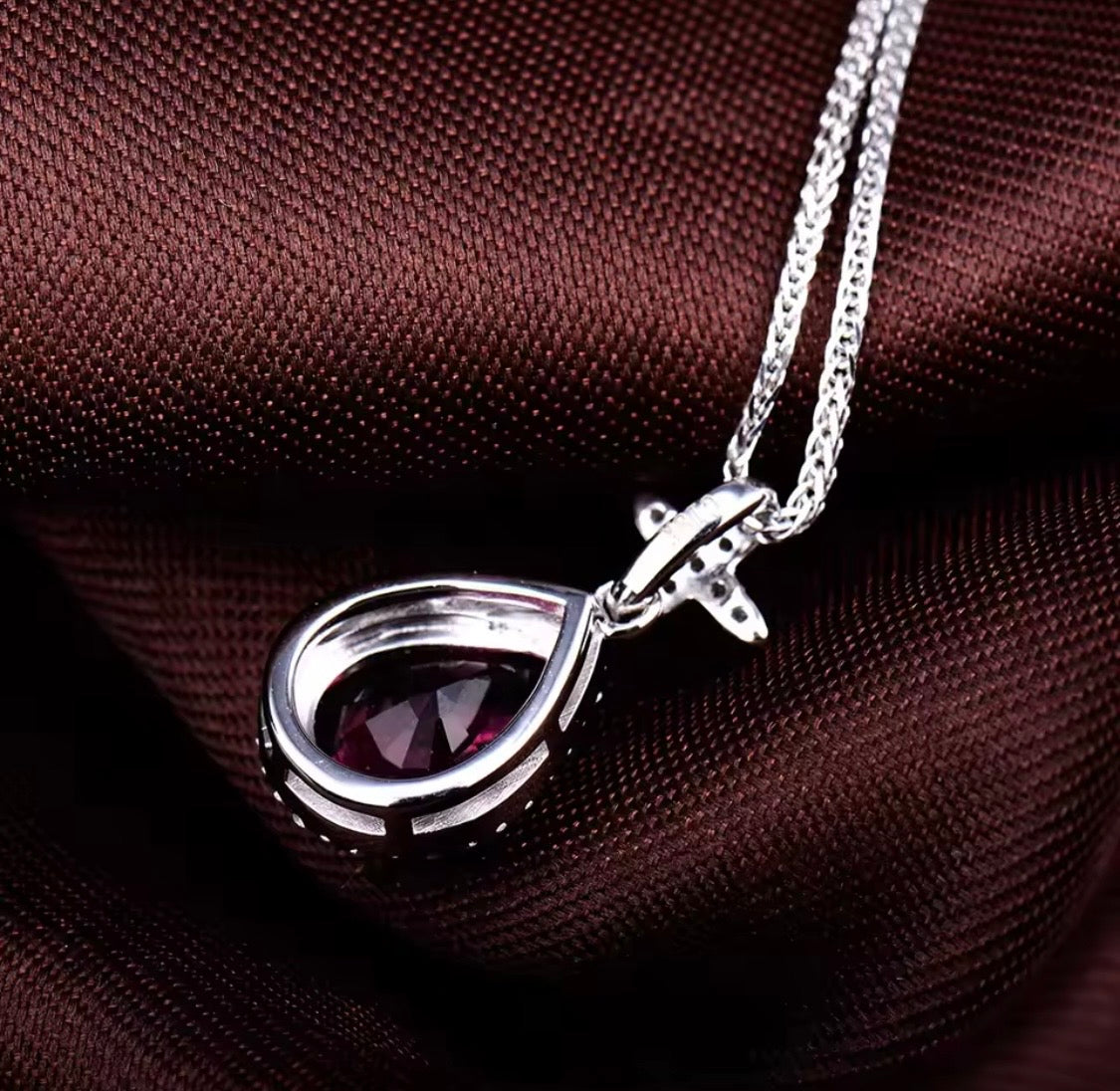 14K white gold pink tourmaline pendant with pear cut gemstone and diamond halo design