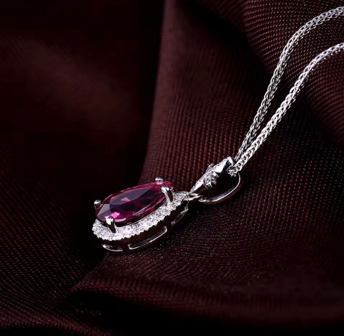 14K white gold pink tourmaline pendant with pear cut gemstone and diamond halo design