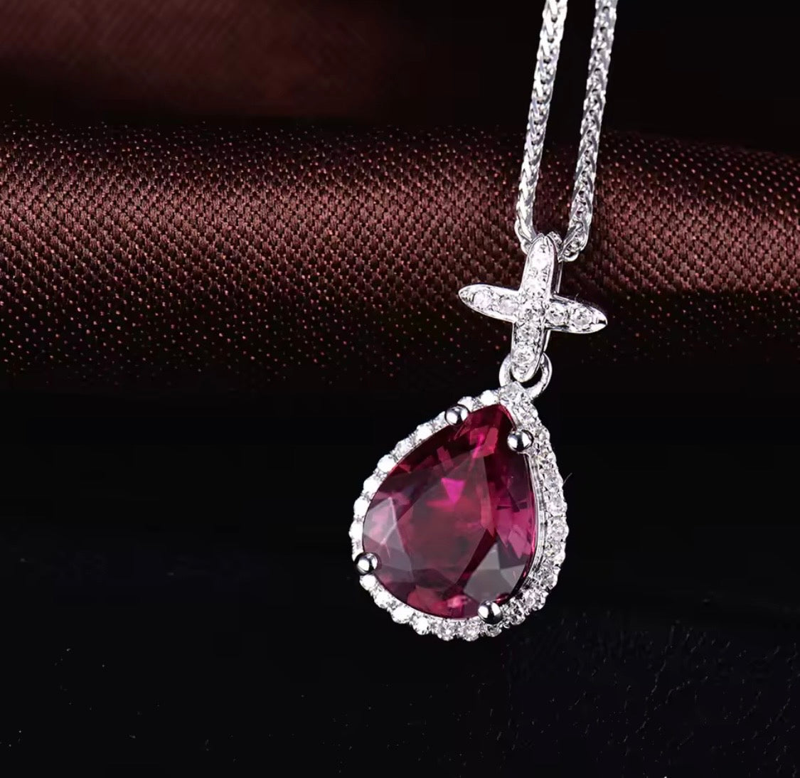 14K white gold pink tourmaline pendant with pear cut gemstone and diamond halo design
