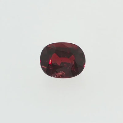 Natural pyrope-almandine garnet, 2.39 carats, oval cut, slightly orangy red color, transparent, ČGL certified gemstone