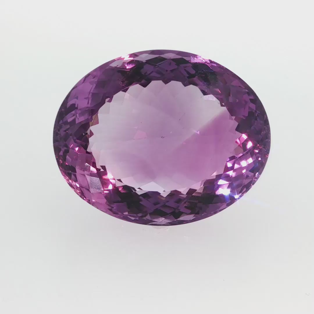 Natural amethyst, 97.50 carats, oval cut, clarity: eye clean, purple color, measuring 33.99 × 27.62 × 16.91 mm
