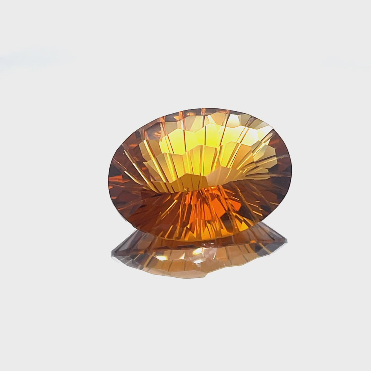 Natural honey citrine, 23.03 carats, oval honeycomb cut, IF clarity, untreated, honey orange color