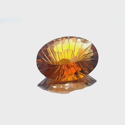 Natural honey citrine, 23.03 carats, oval honeycomb cut, IF clarity, untreated, honey orange color
