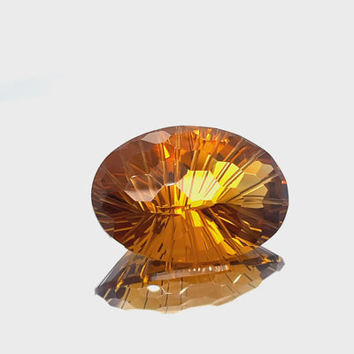 Natural honey citrine, 39.86 carats, oval honeycomb cut, IF clarity, untreated, honey orange color