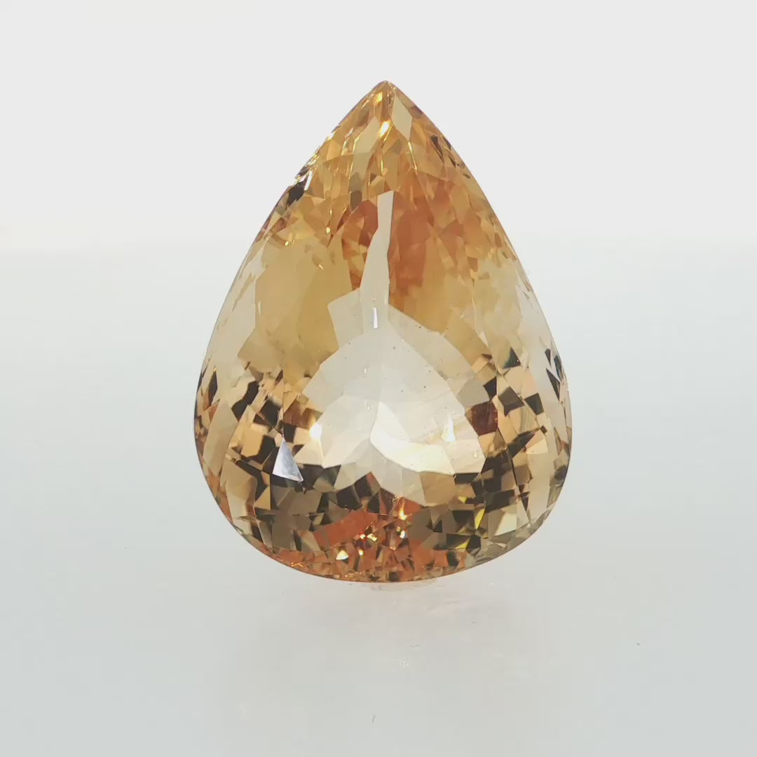 Natural citrine, 61.70 carats, pear cut, eye clean clarity, golden-yellow color, 30.04 × 22.78 × 14.16 mm