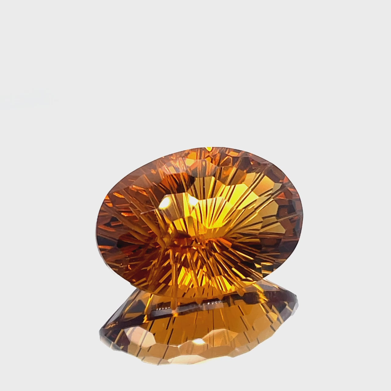 Natural honey citrine, 38.82 carats, oval honeycomb cut, IF clarity, untreated, honey orange color