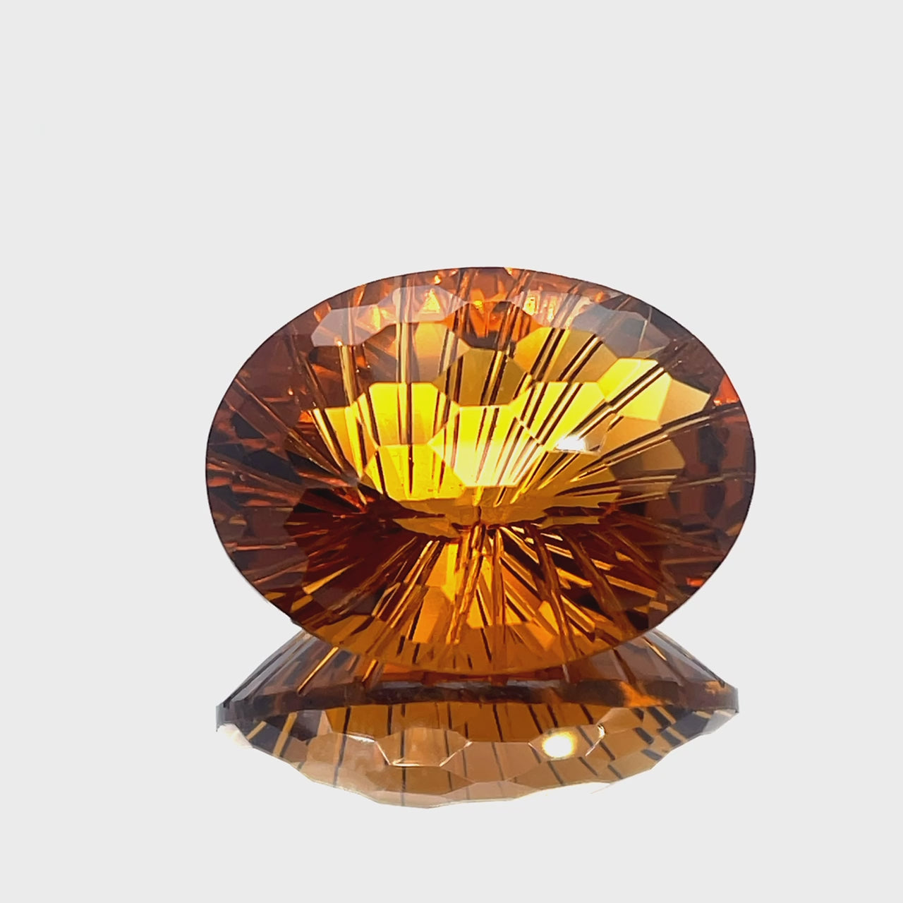 Natural honey citrine, 41.40 carats, oval honeycomb cut, IF clarity, untreated, honey orange color