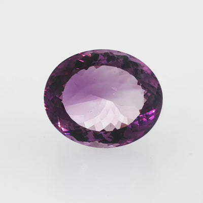 Natural amethyst, 106.80 carats, oval cut, clarity: eye clean, purple color, measuring 35.65 × 29.53 × 17.48 mm